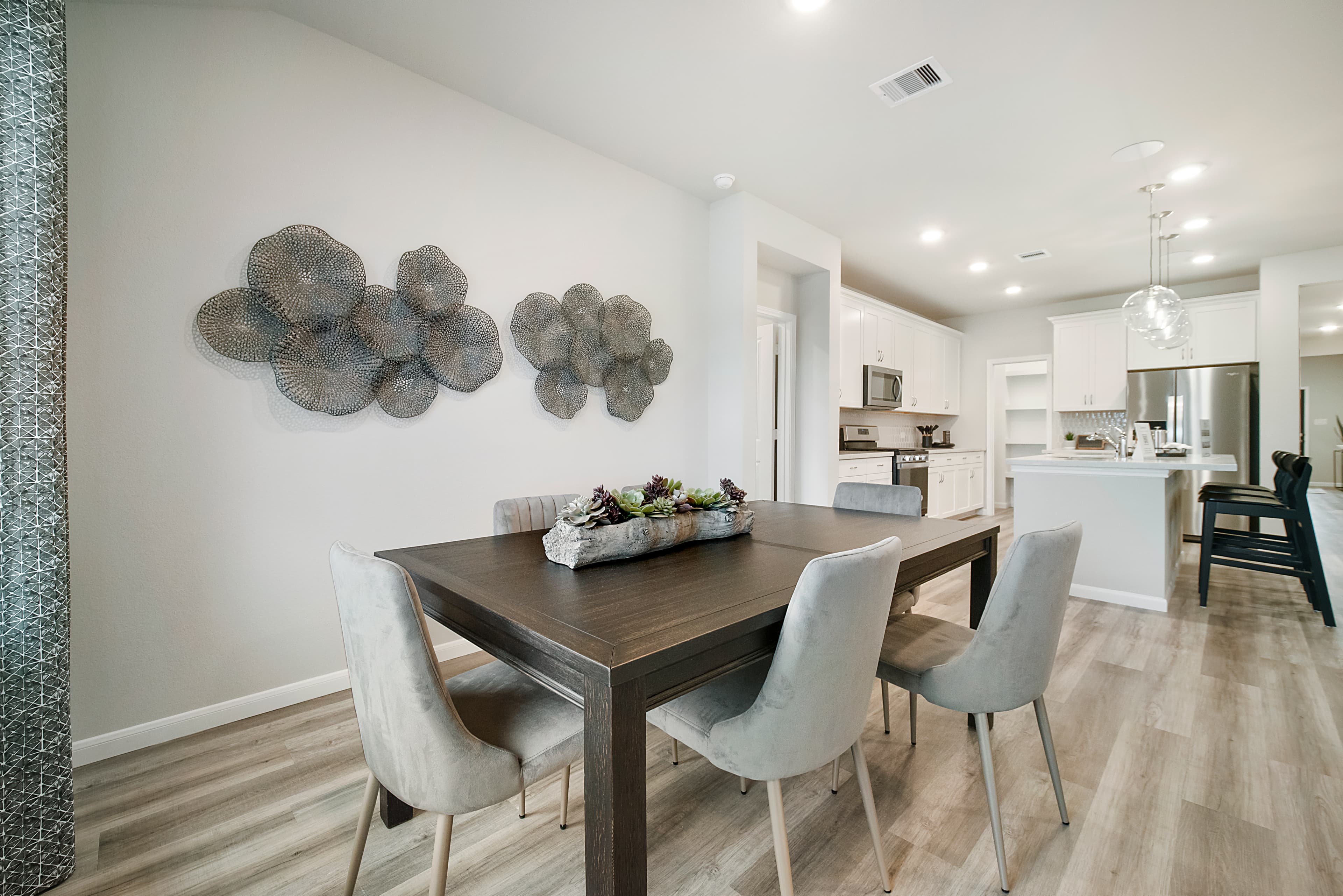 casual dining room with wood-like vinyl flooring