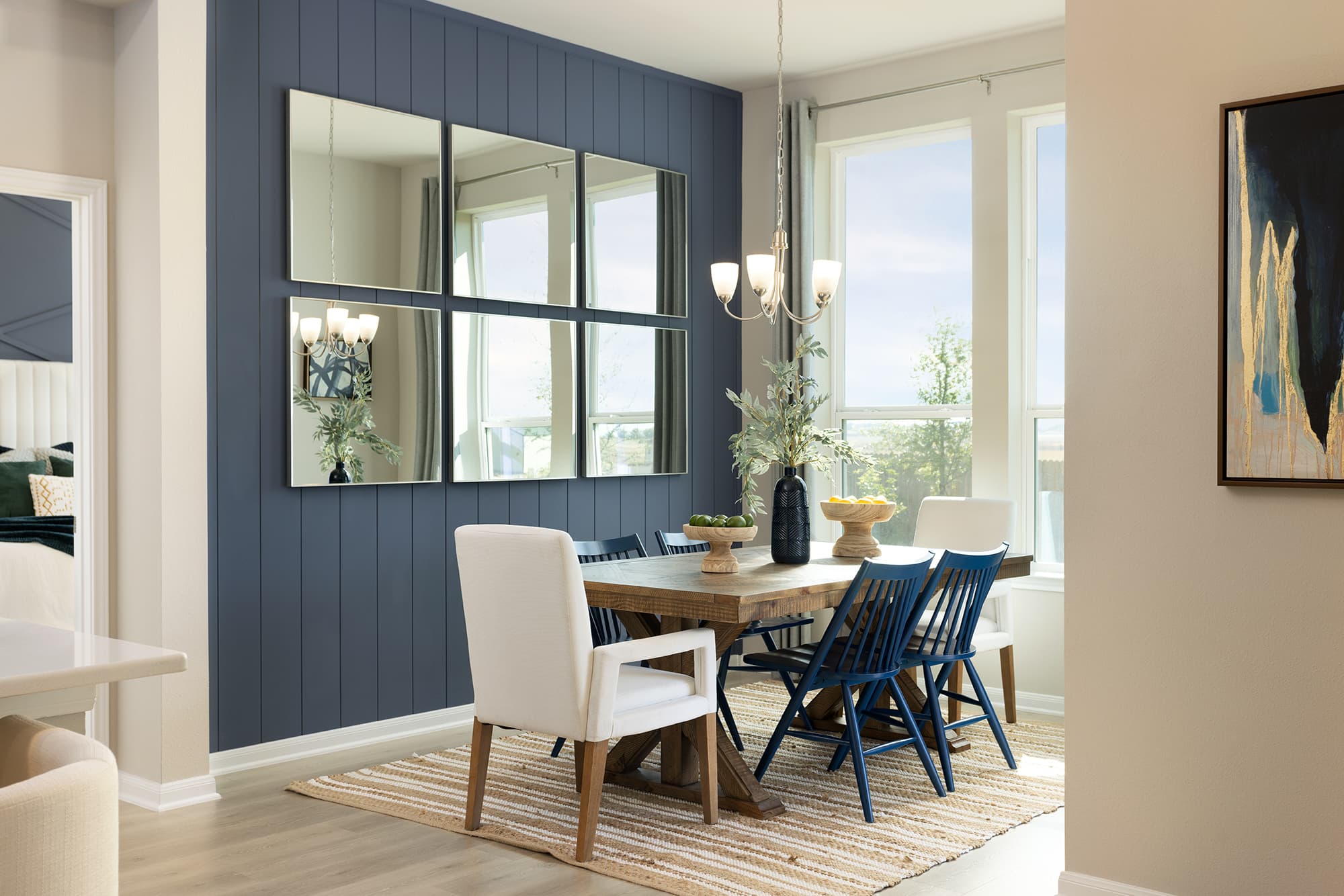 dining room with rug, brown table & chairs
