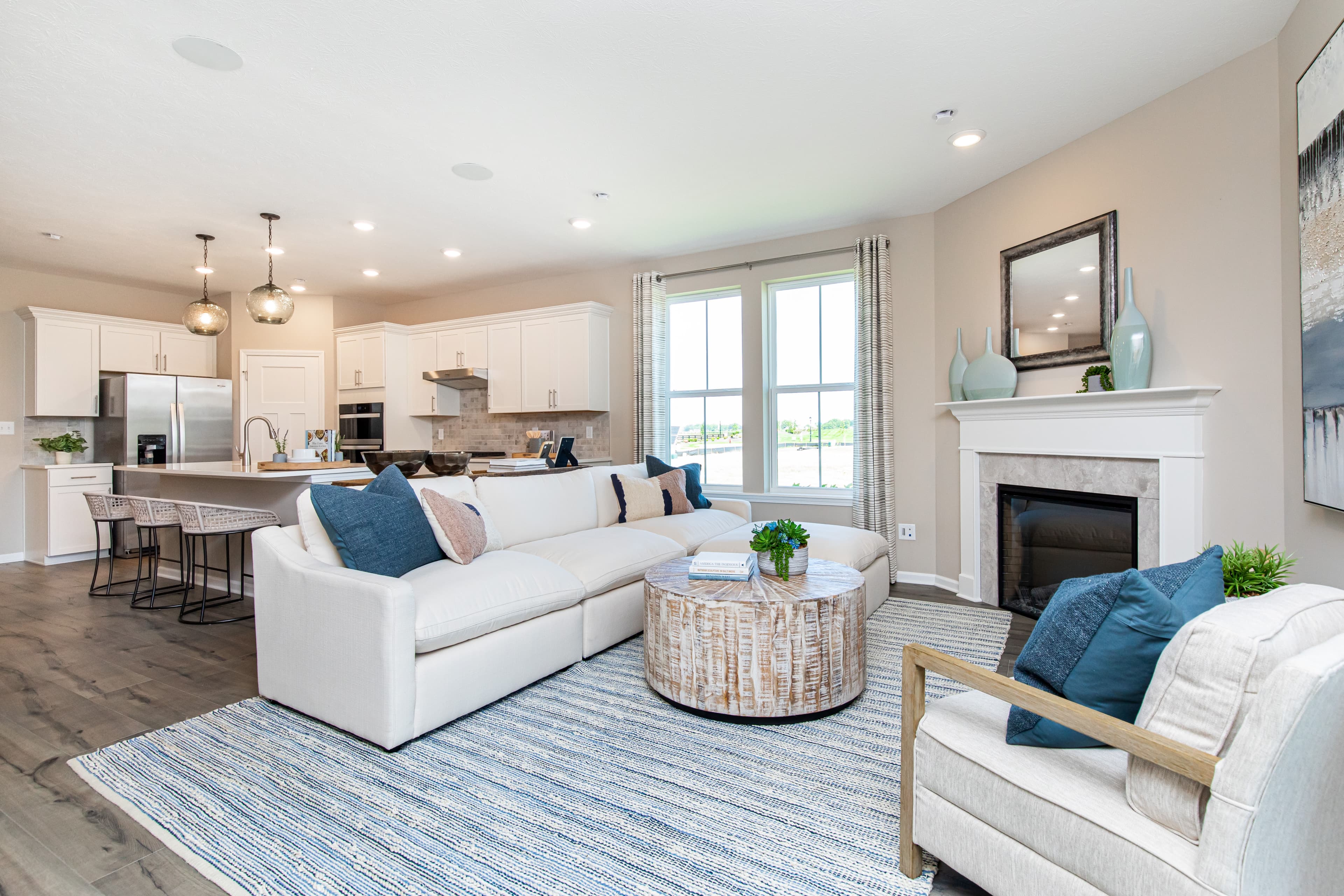 great room with fireplace and hardwood floors 