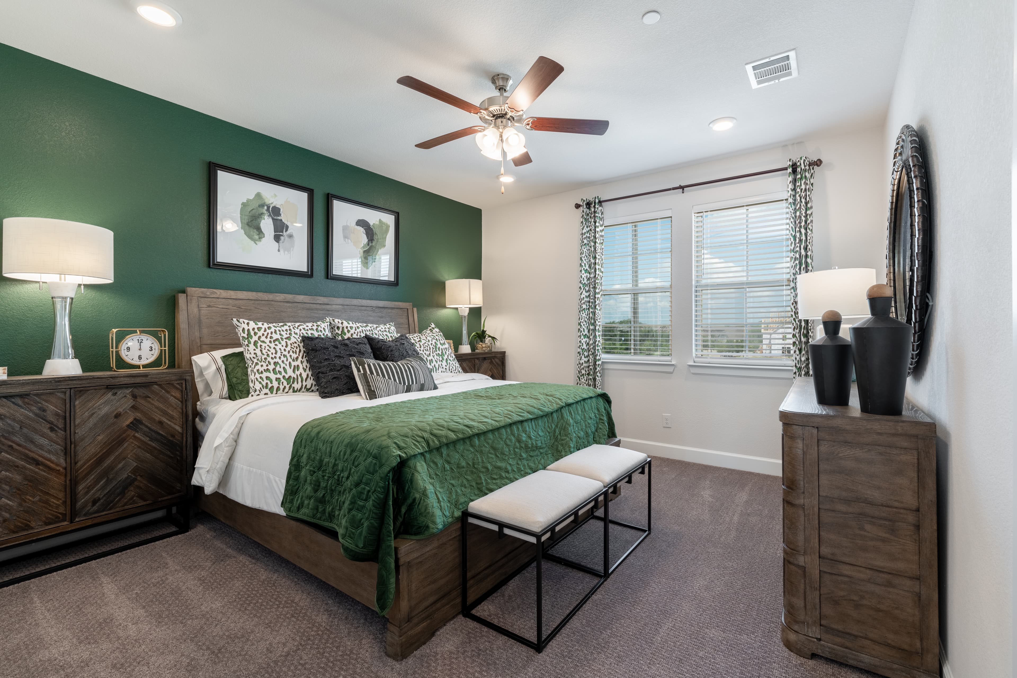 primary bedroom with green accent wall 