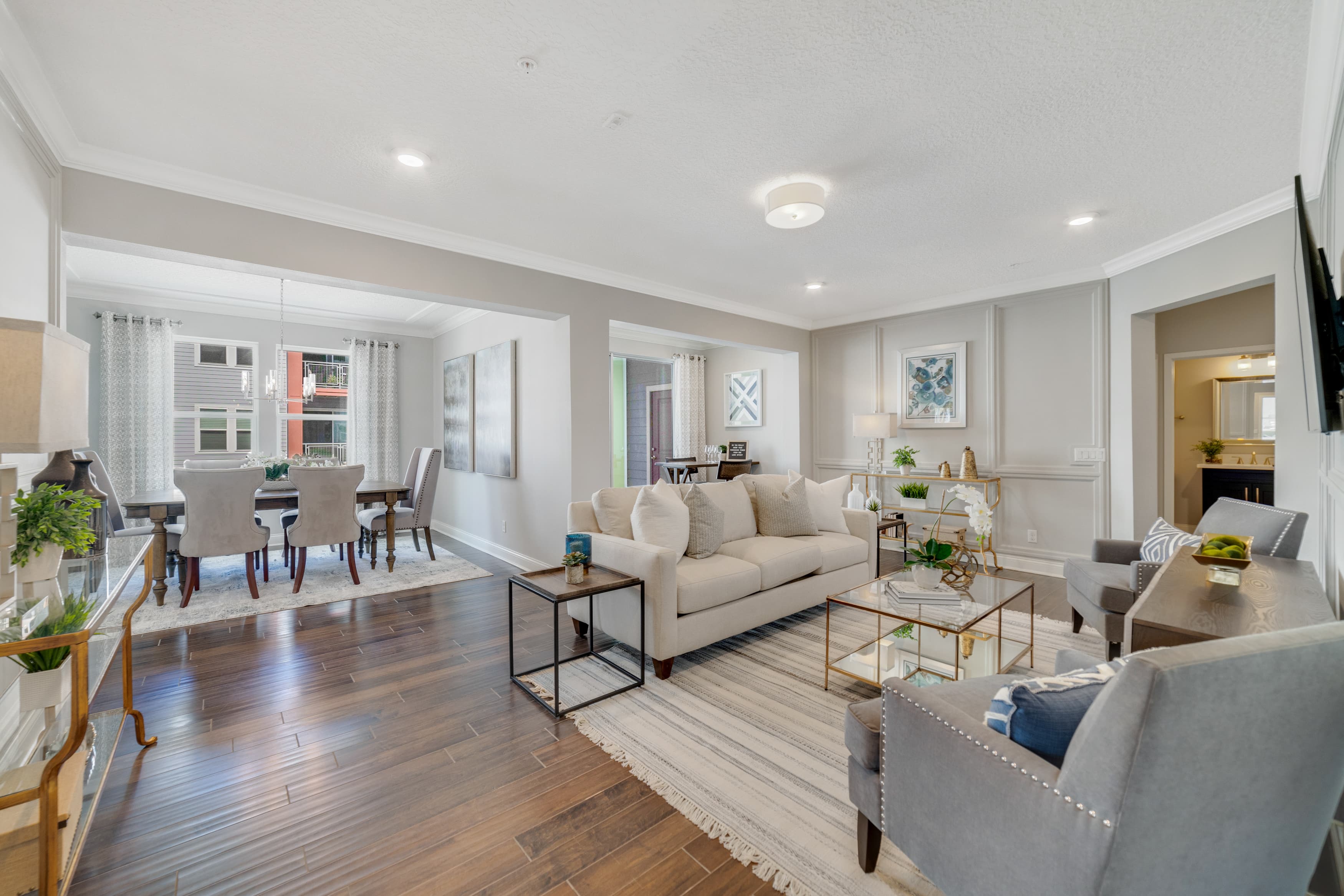 light-filled great room with wood flooring