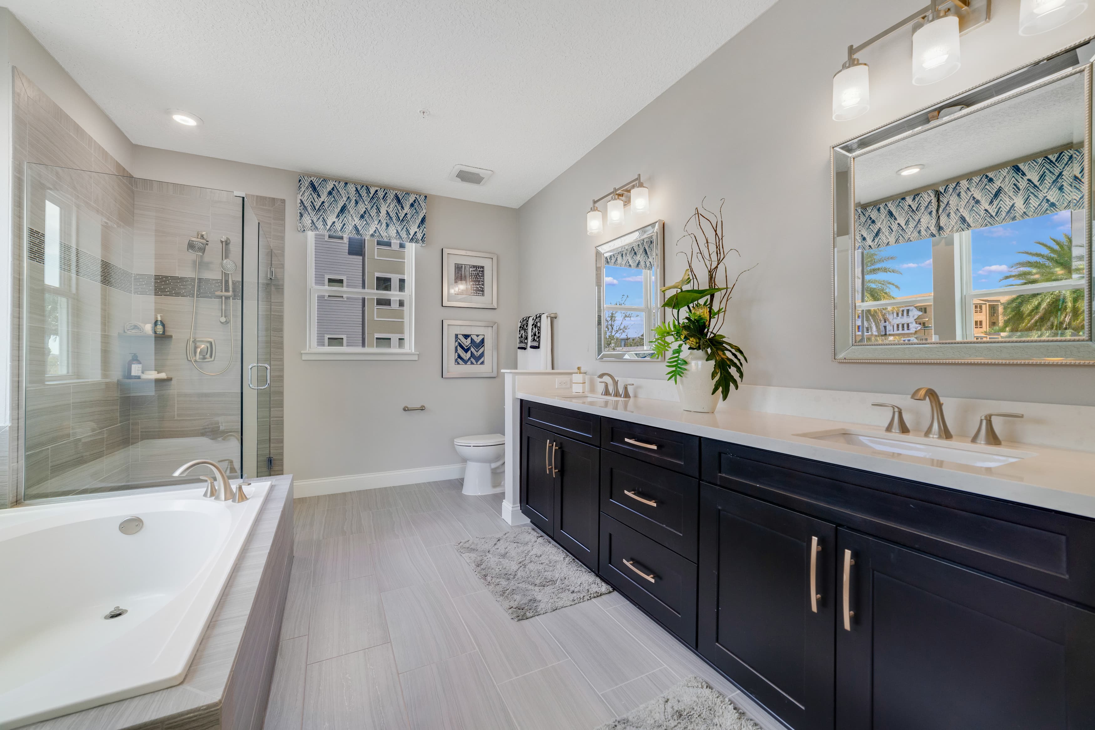 primary bathroom with tub and separate shower