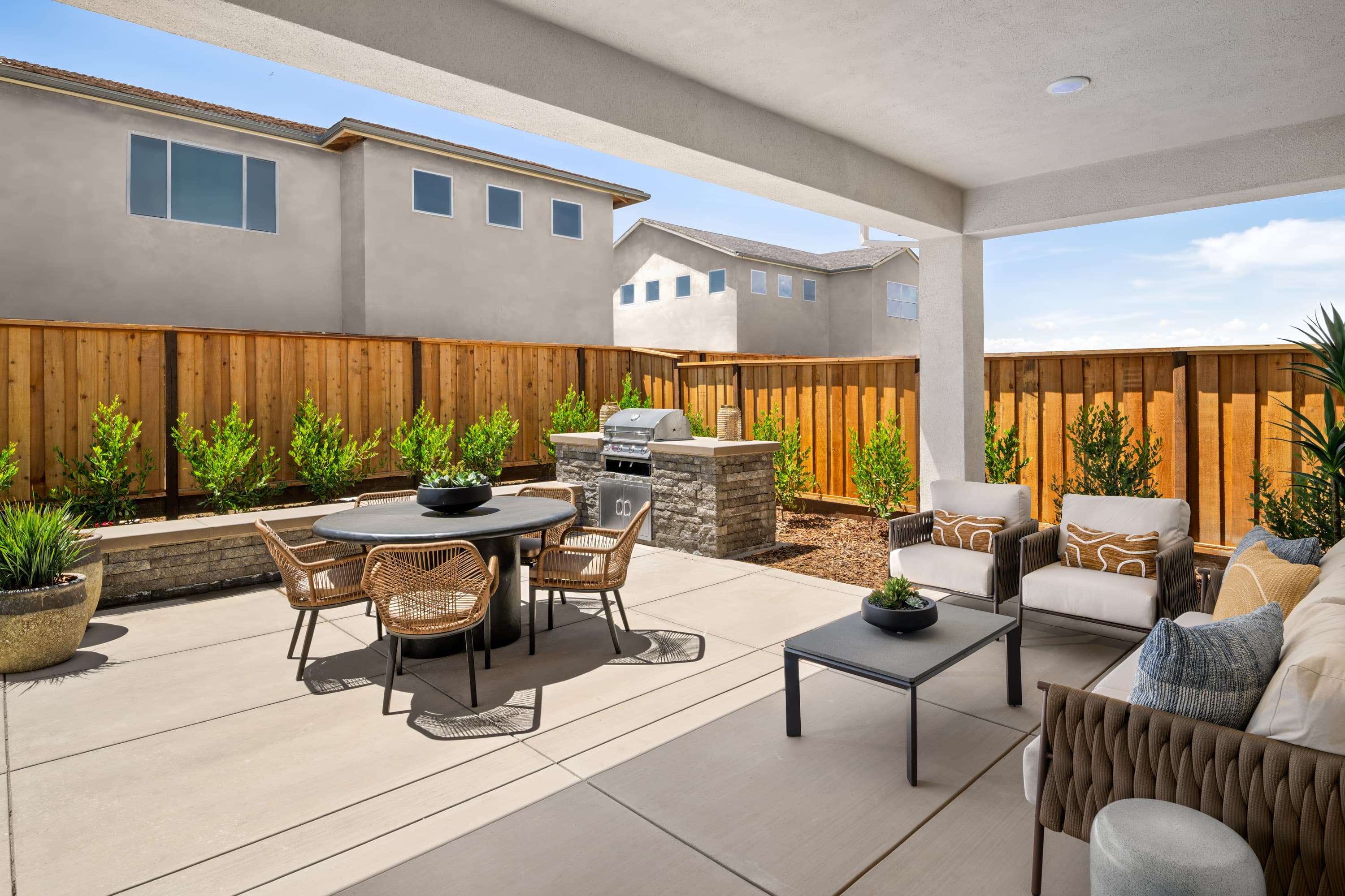 spacious backyard with seating area and barbecue