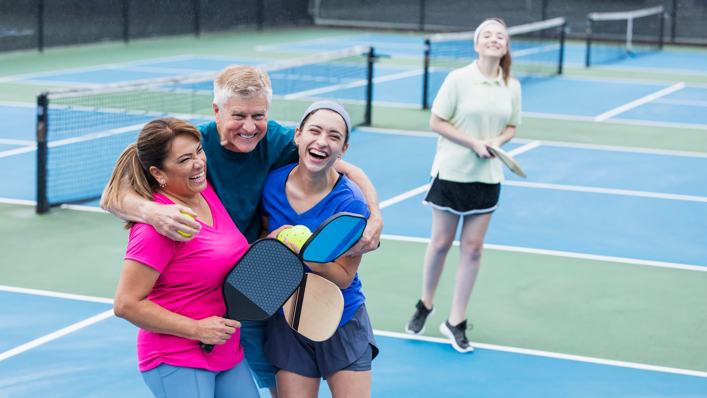 people enjoying a game of pickleball