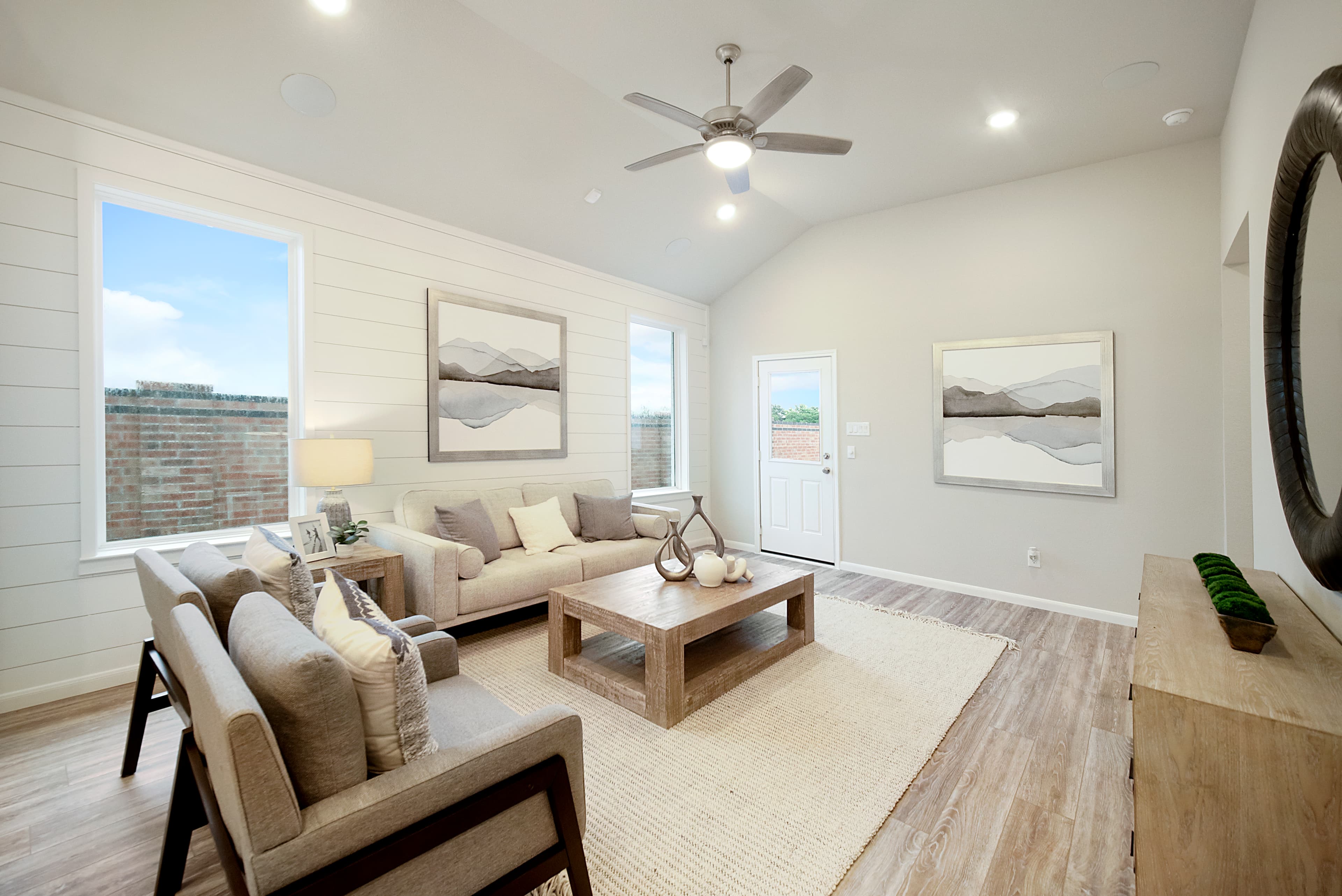 great room with ceiling fan