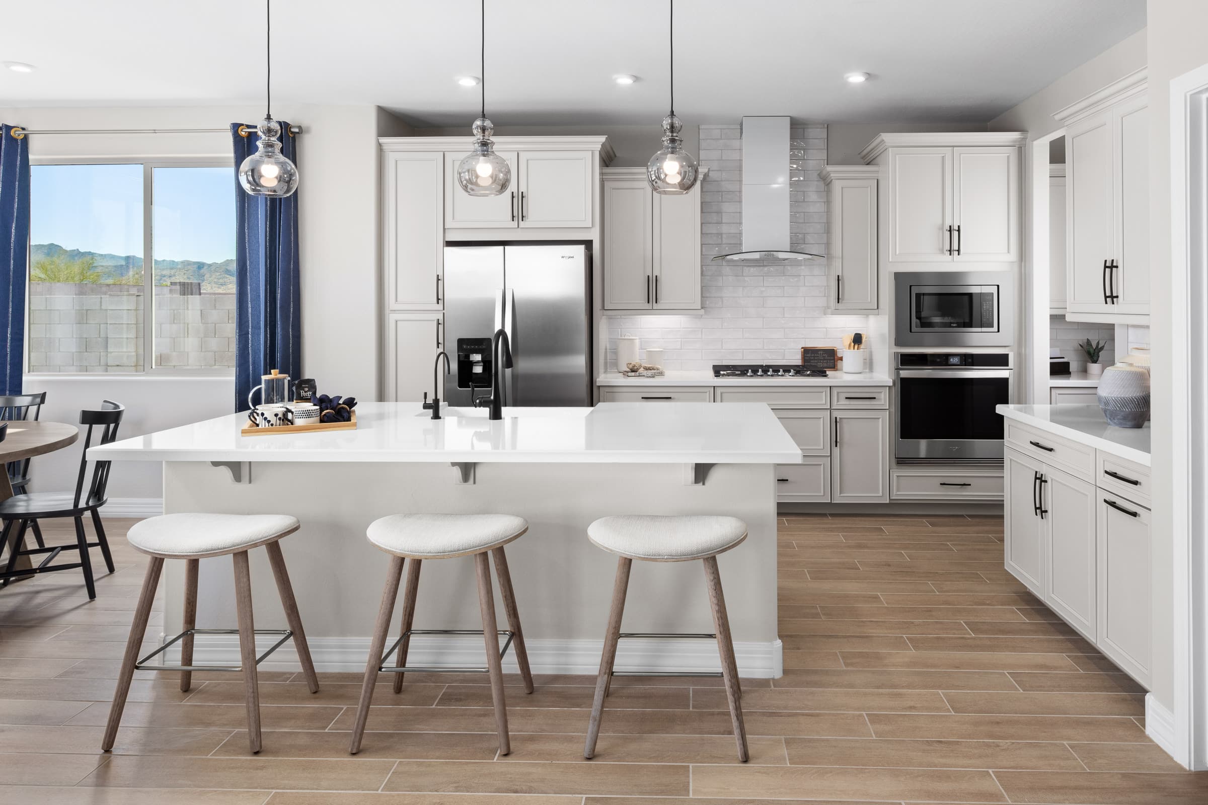open-concept kitchen with pendant lights