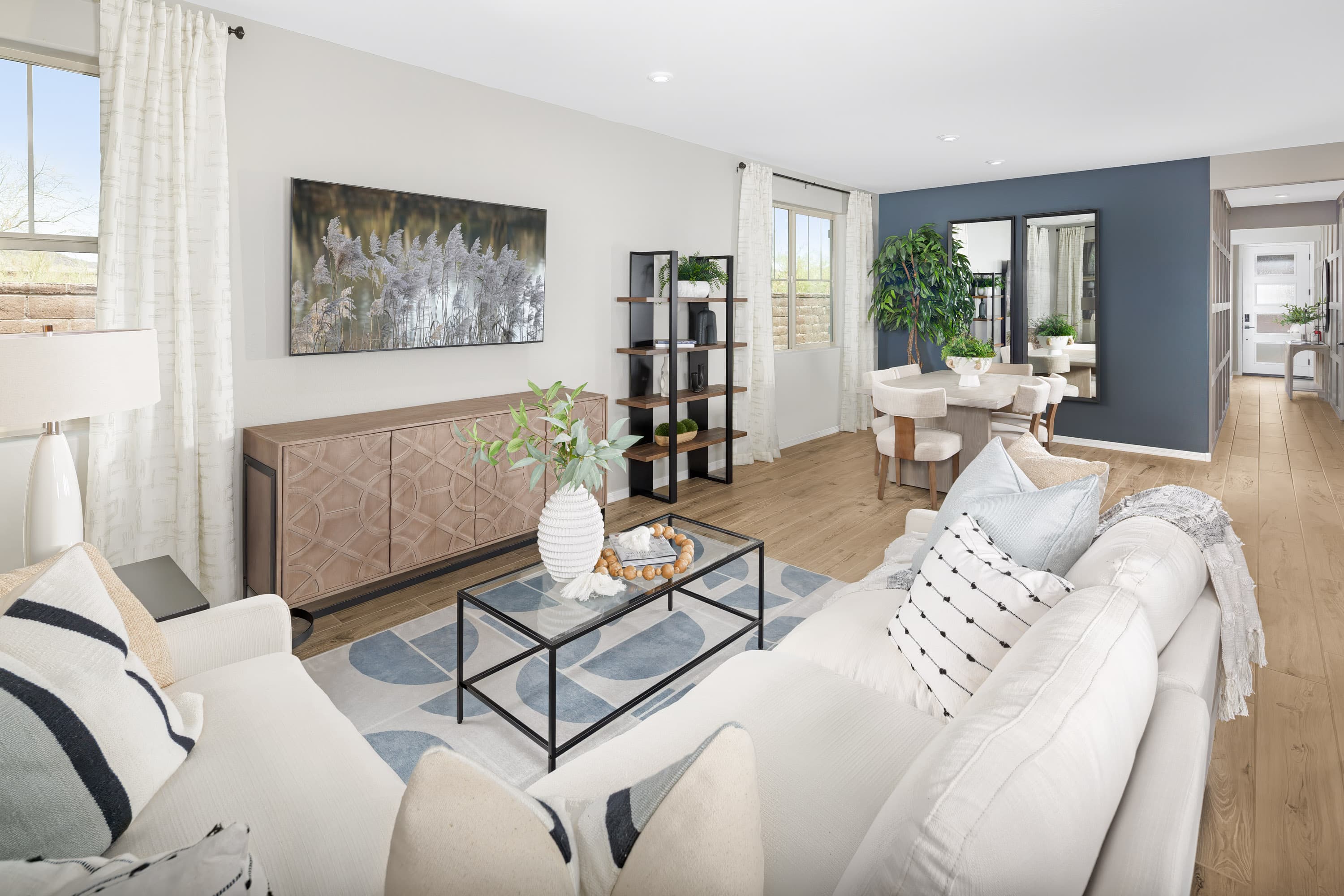 open-concept living area with sofa and chairs
