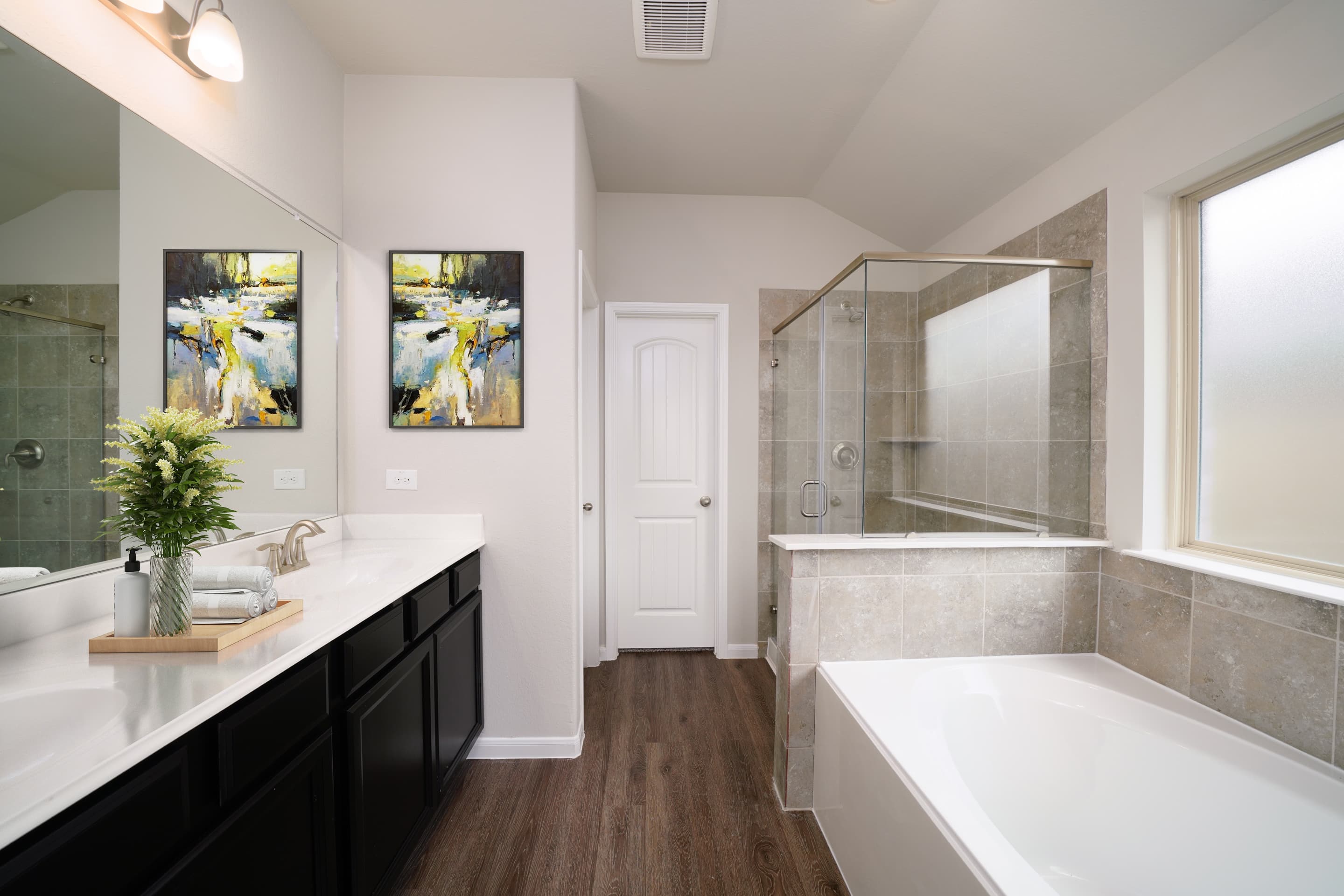 primary bathroom with walk-in shower and tub