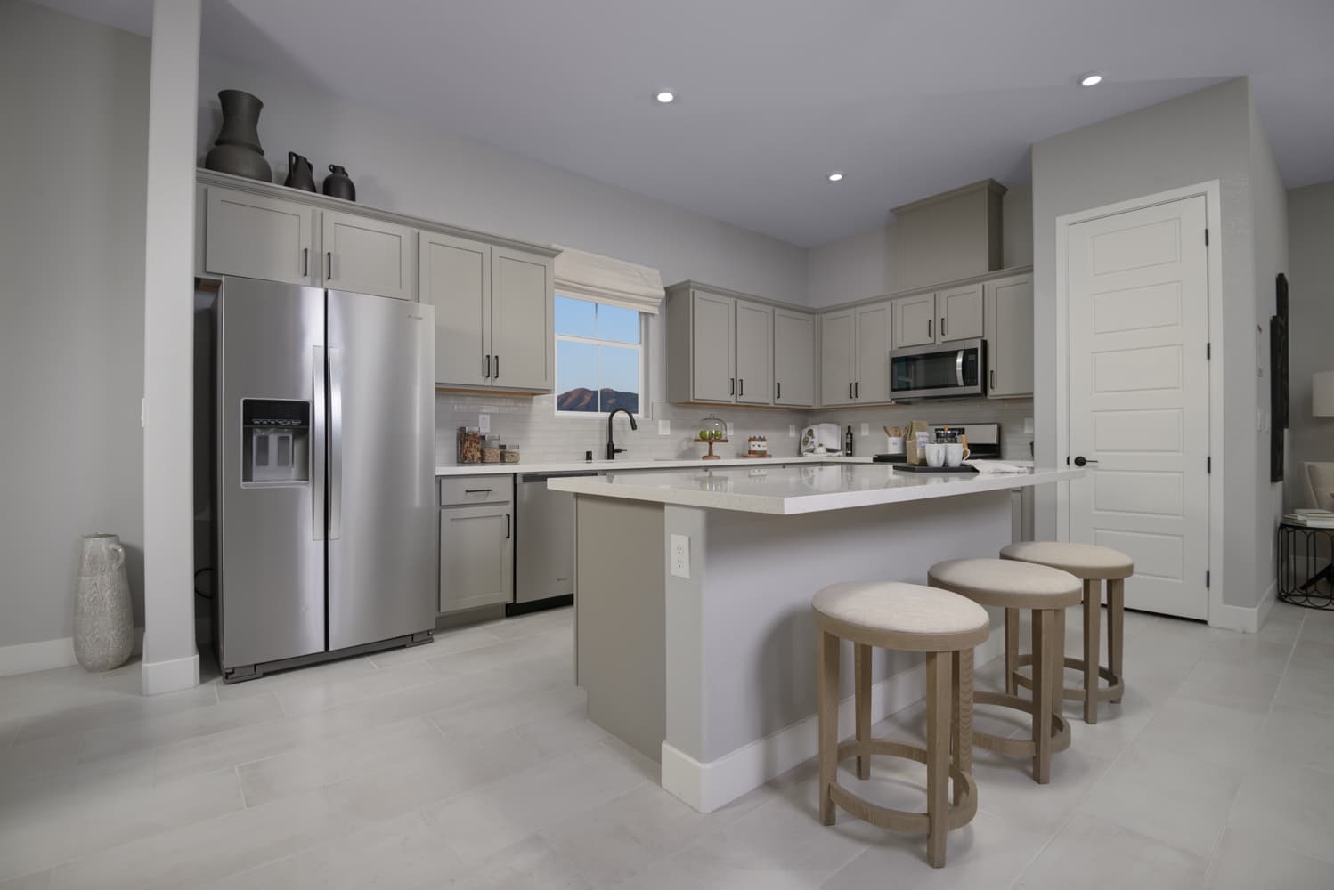 kitchen with stainless appliances & gray cabinets