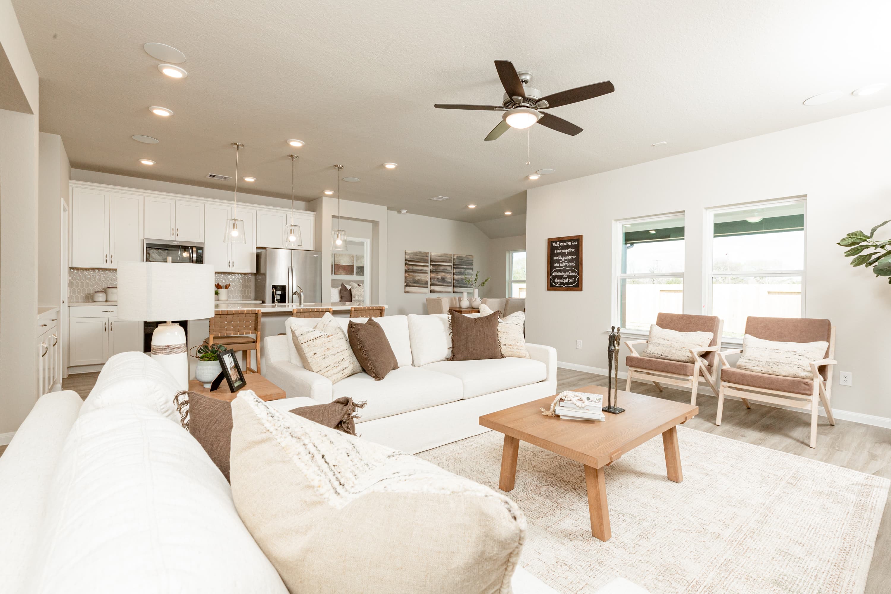 great room with ceiling fan