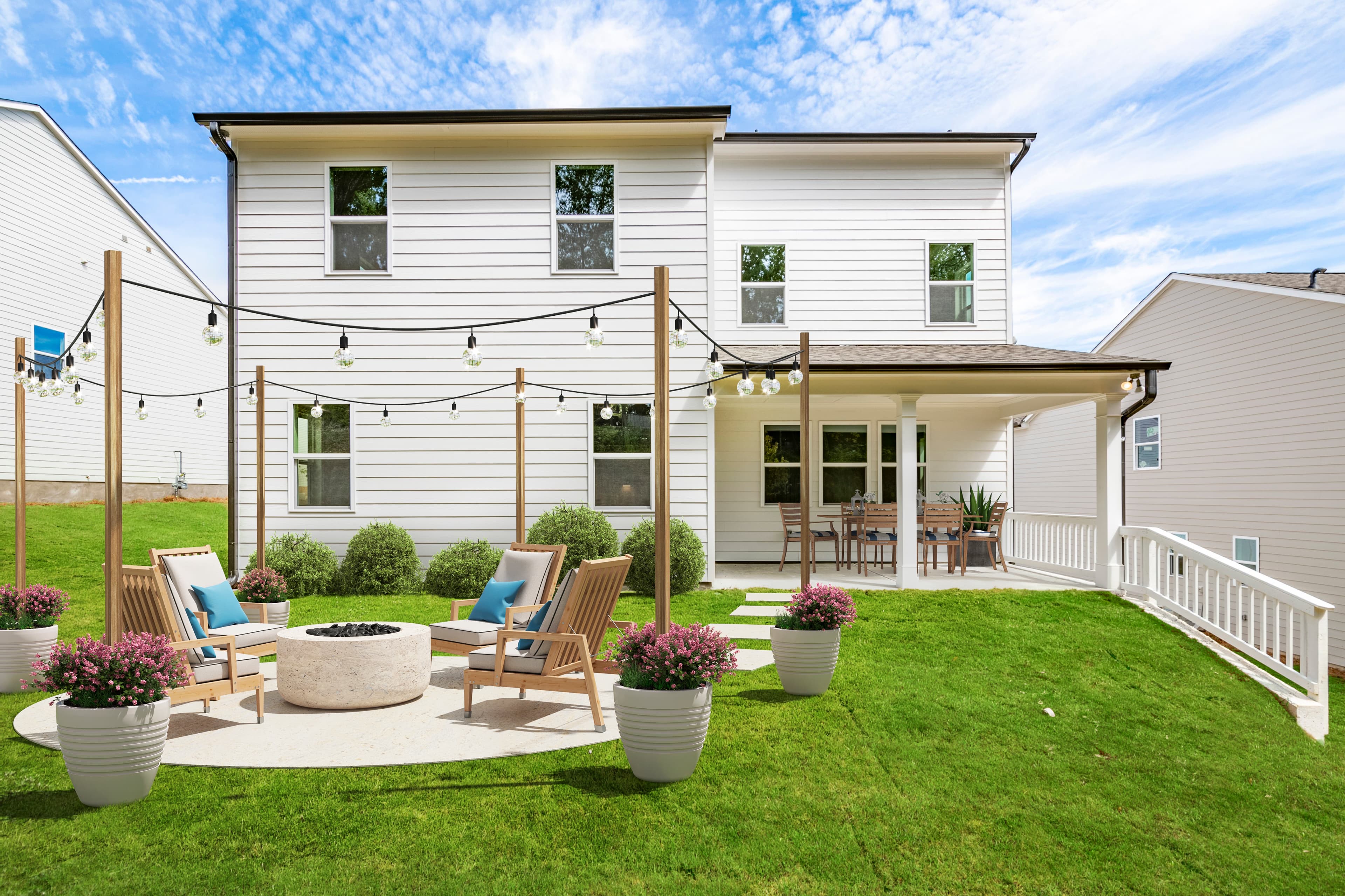 backyard with outdoor fireplace & patio table