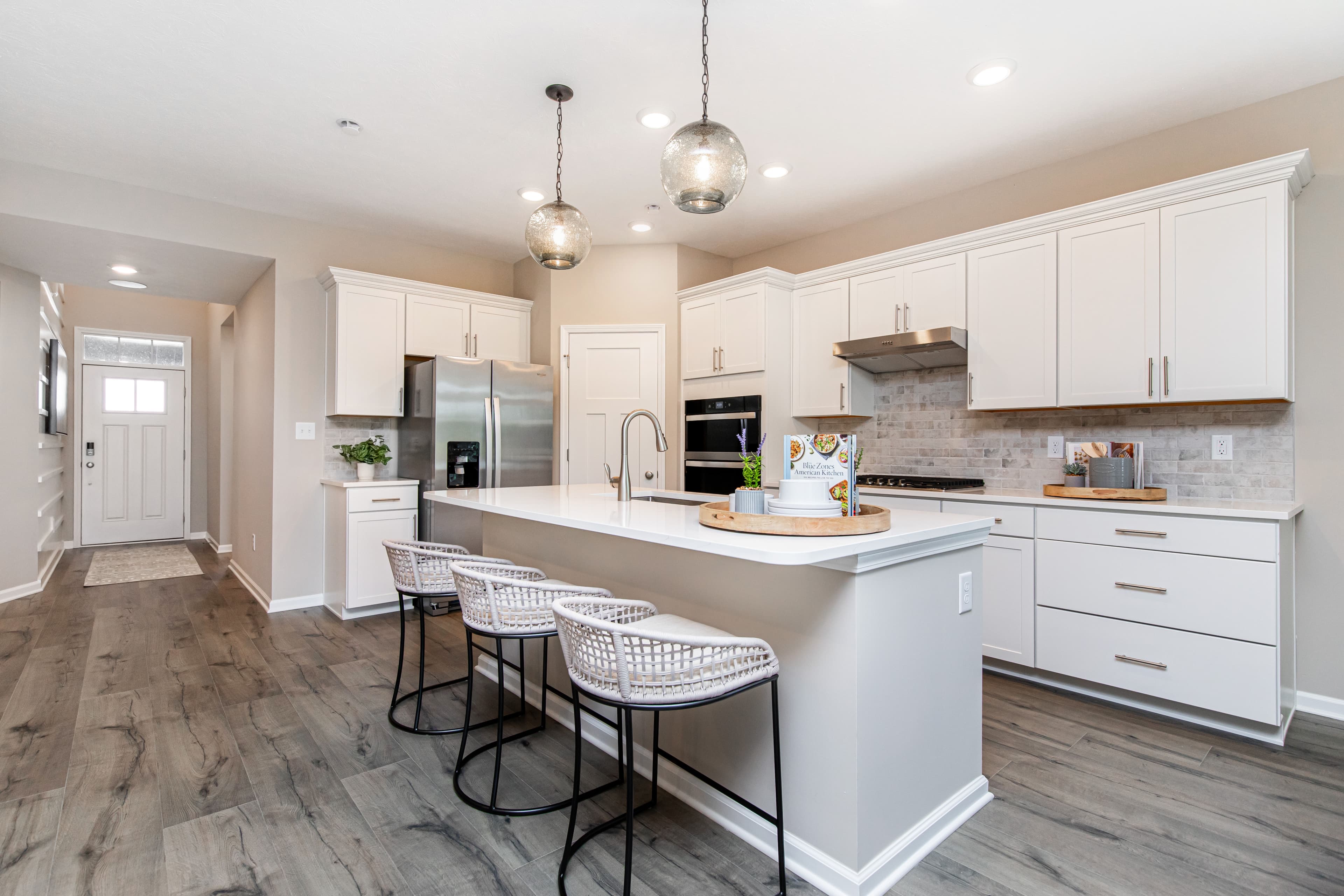 kitchen with white cabinets and spacious island 