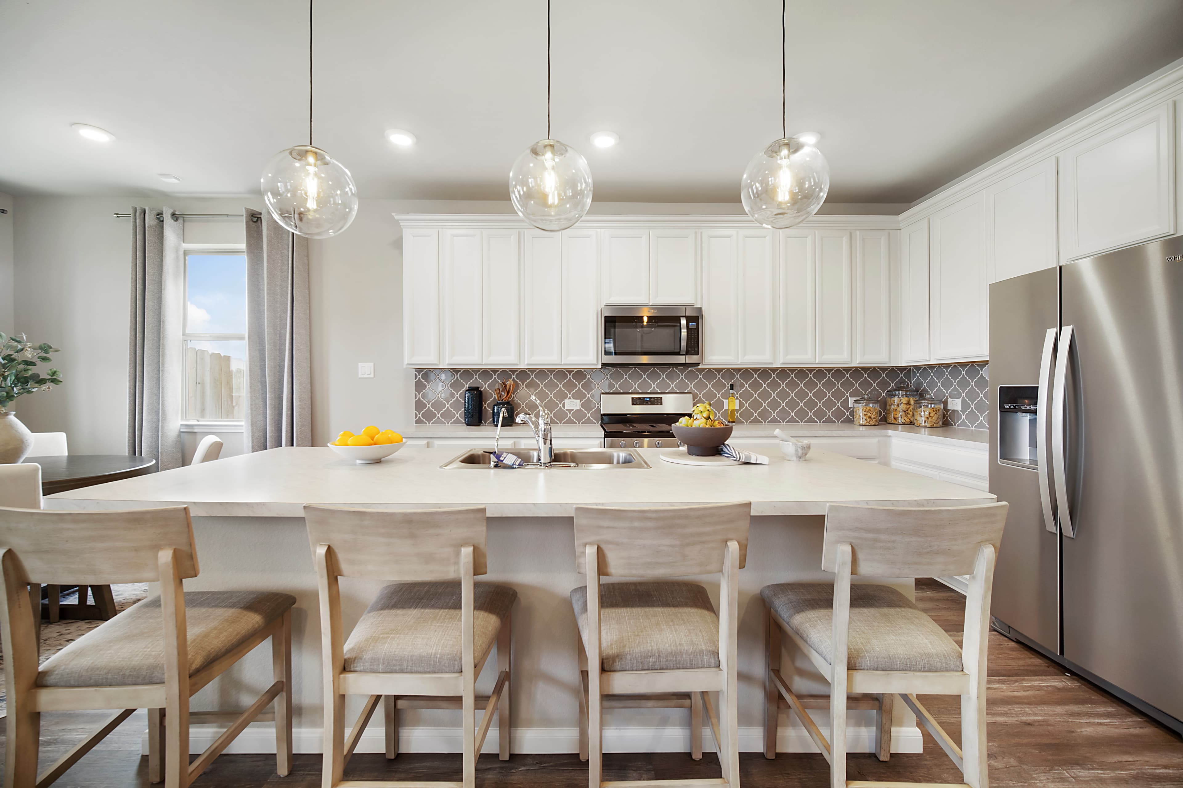 kitchen with large island and bar stools