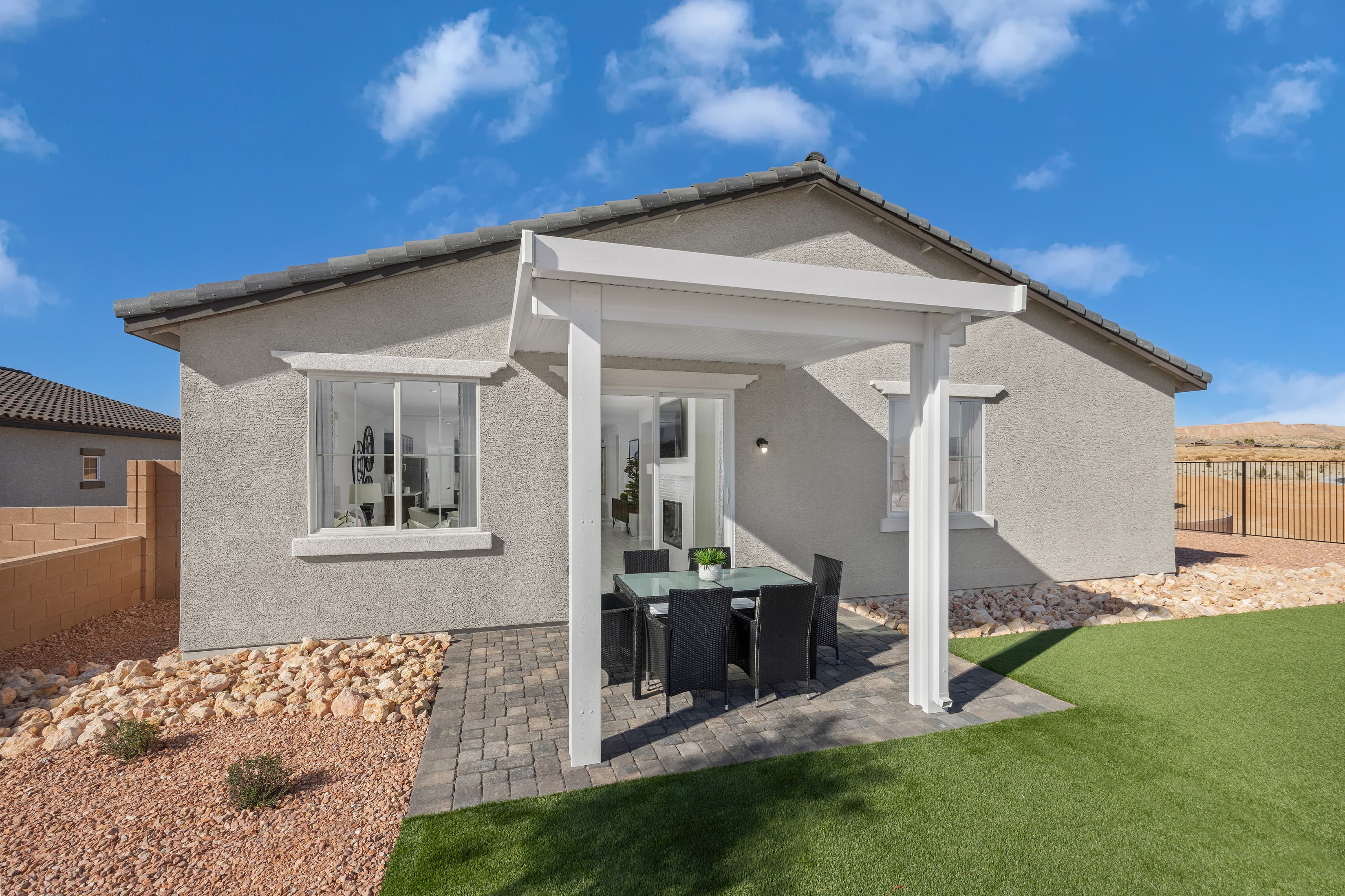 backyard with covered patio and brick pavers
