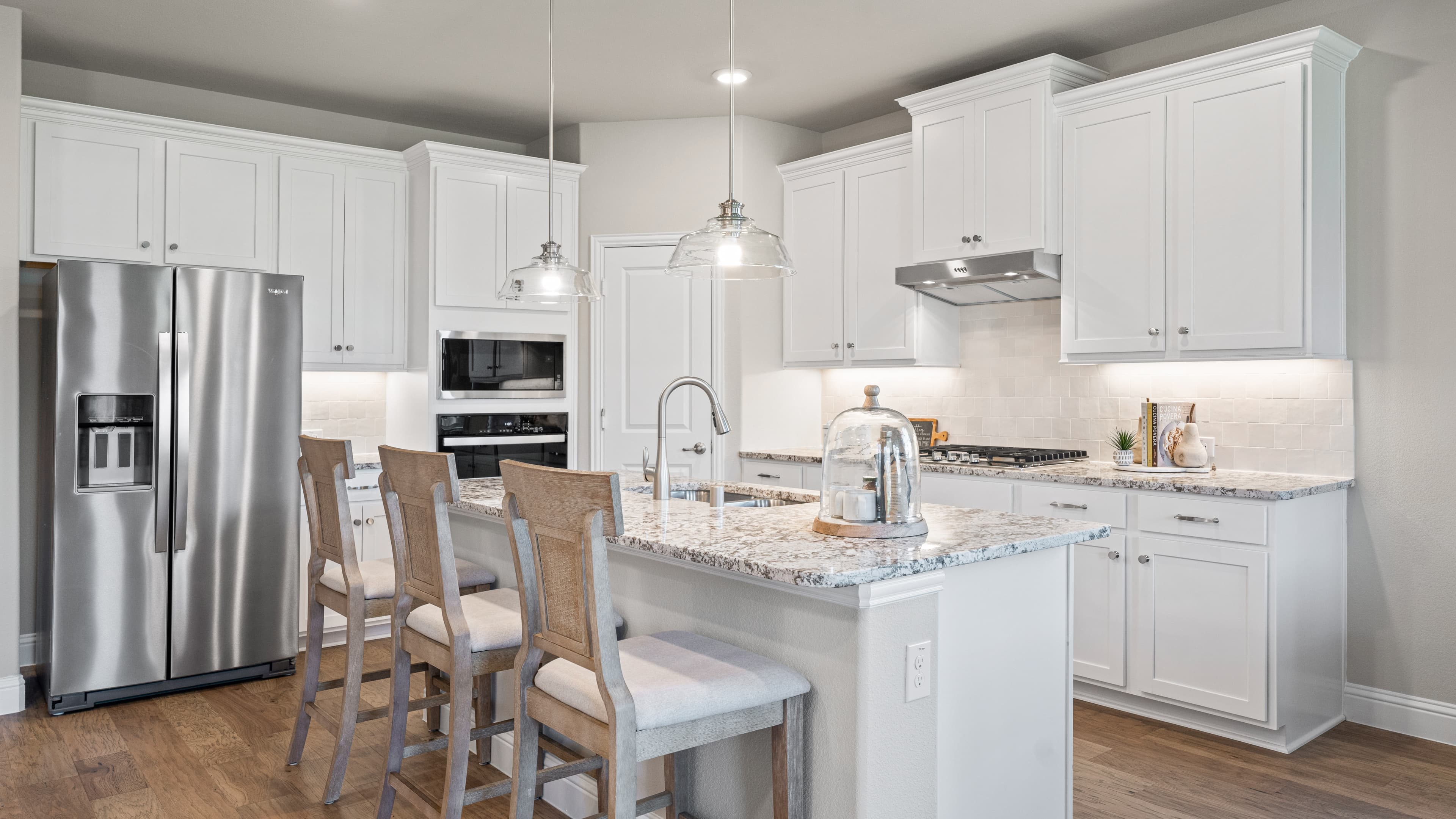 open kitchen with large island and white cabinets