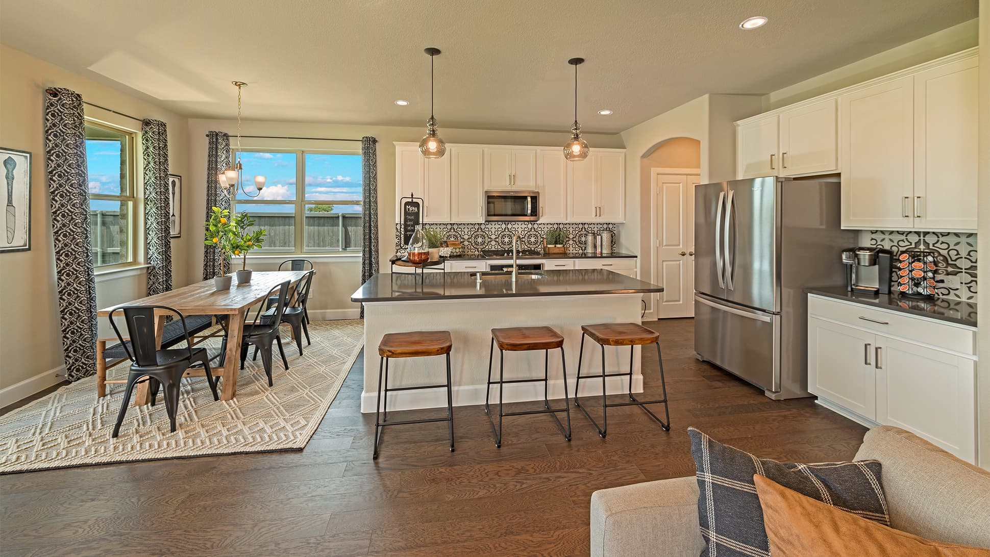 open kitchen with large island and wood floors