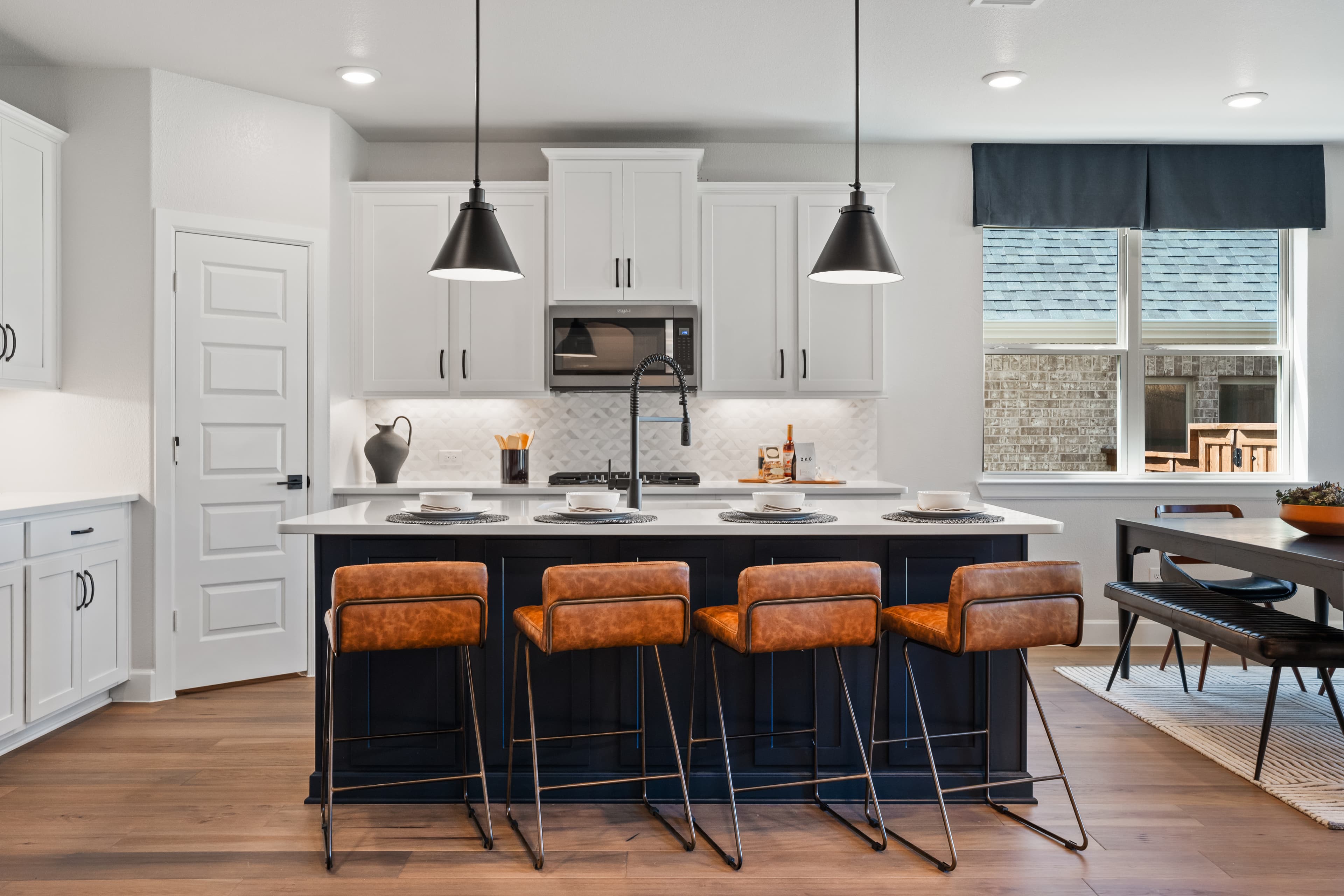 open kitchen with large island and wood floors