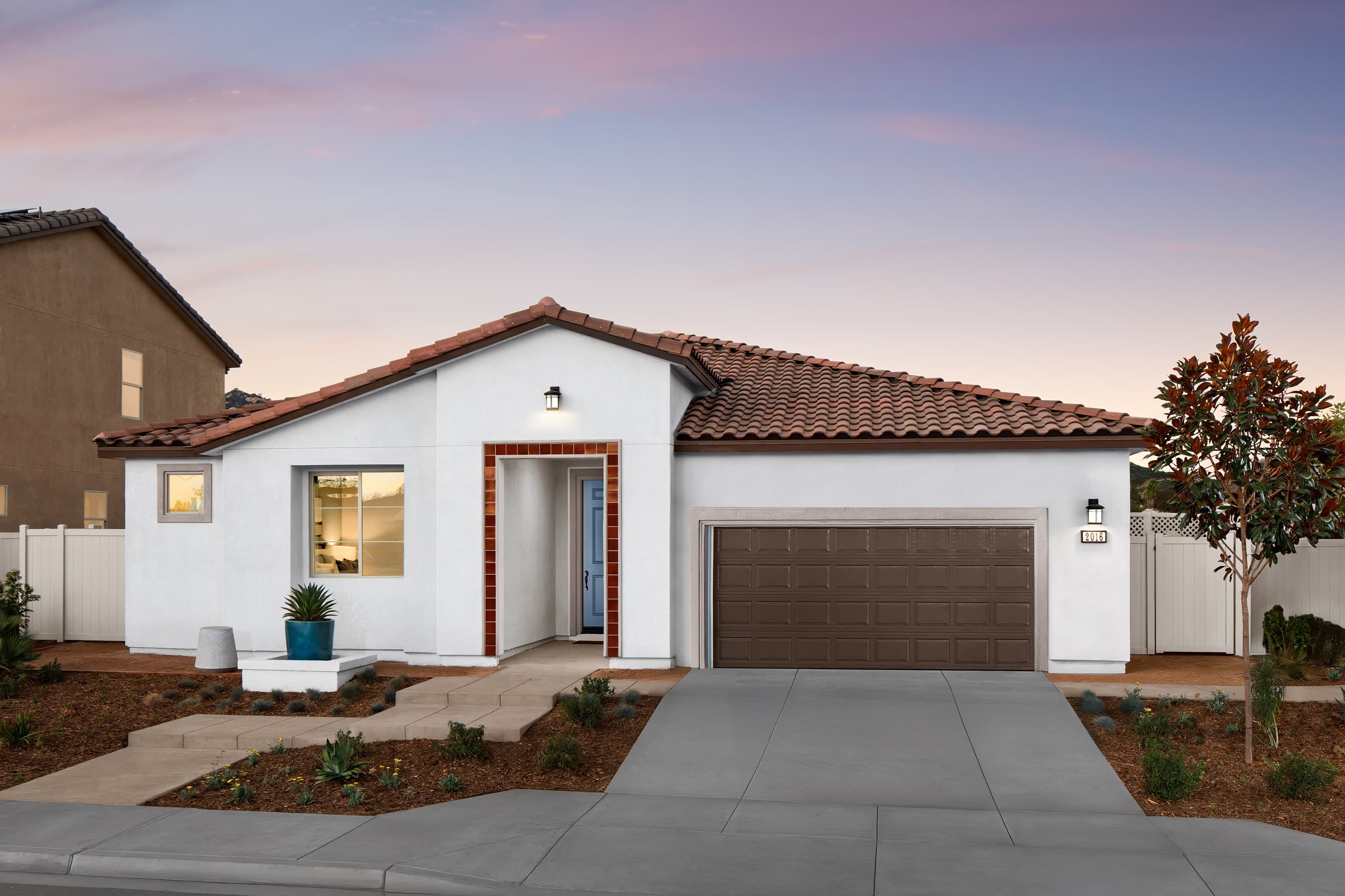 exterior features a brown windowless garage