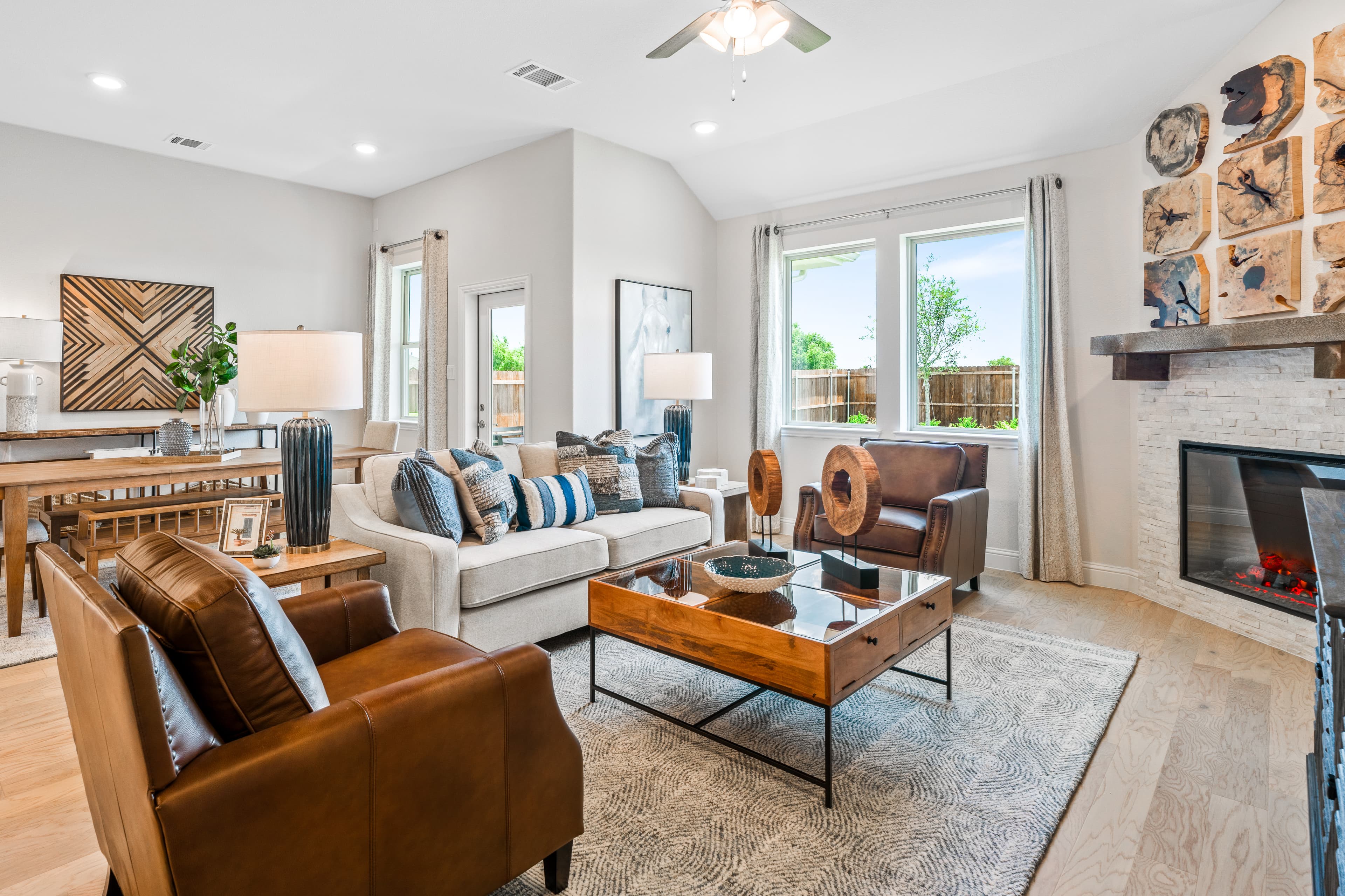 open great room with wood floors and fireplace