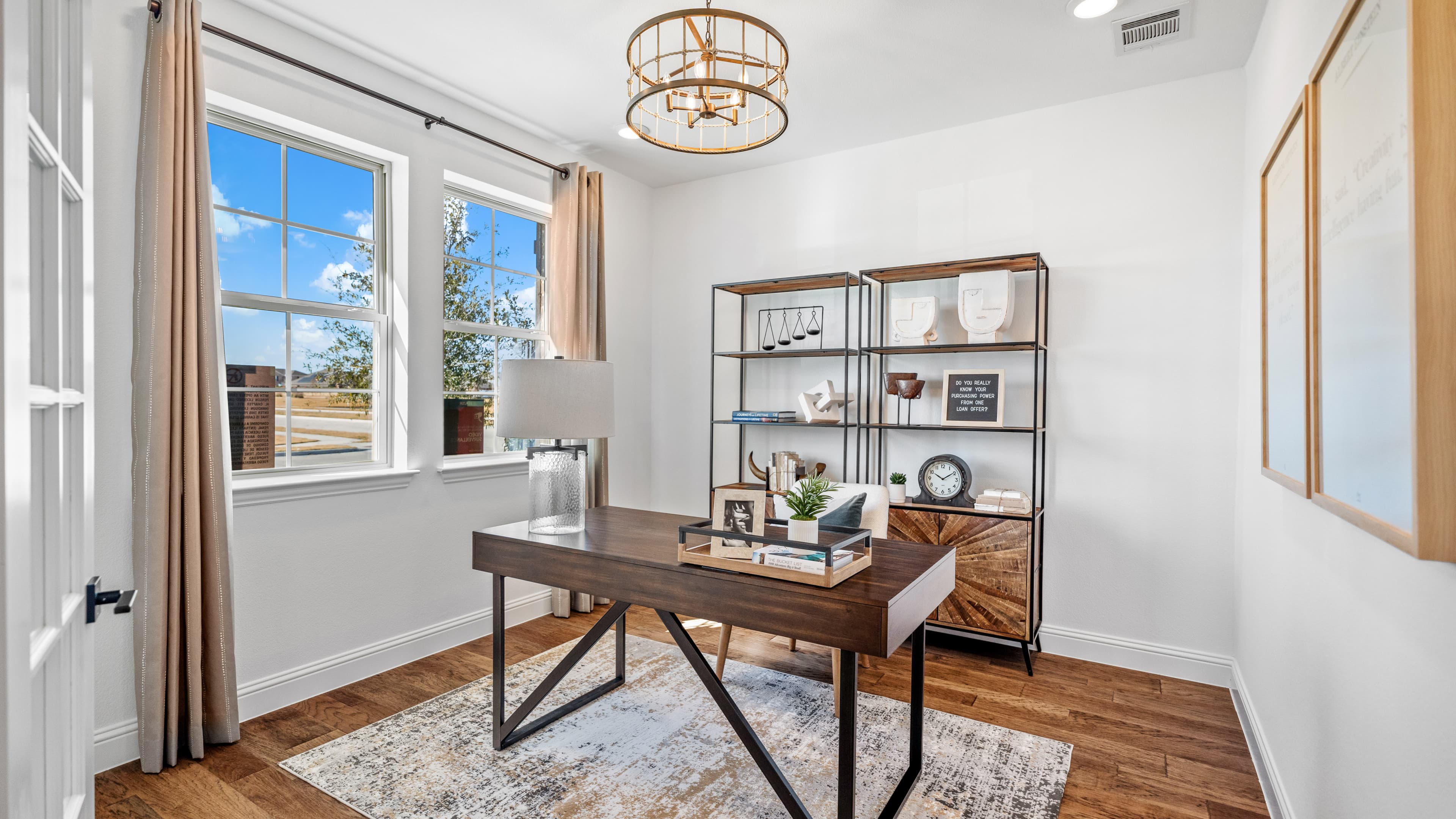 private study with two windows and wood floors