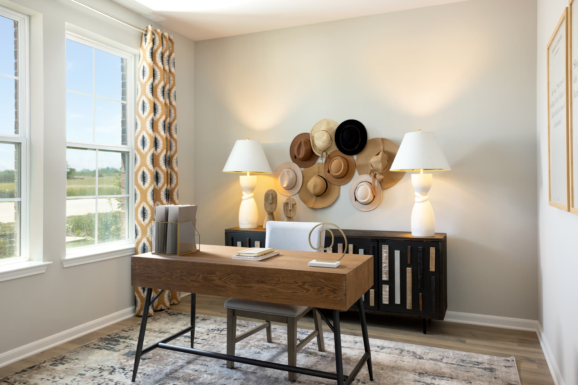 study with desk, rug & large windows
