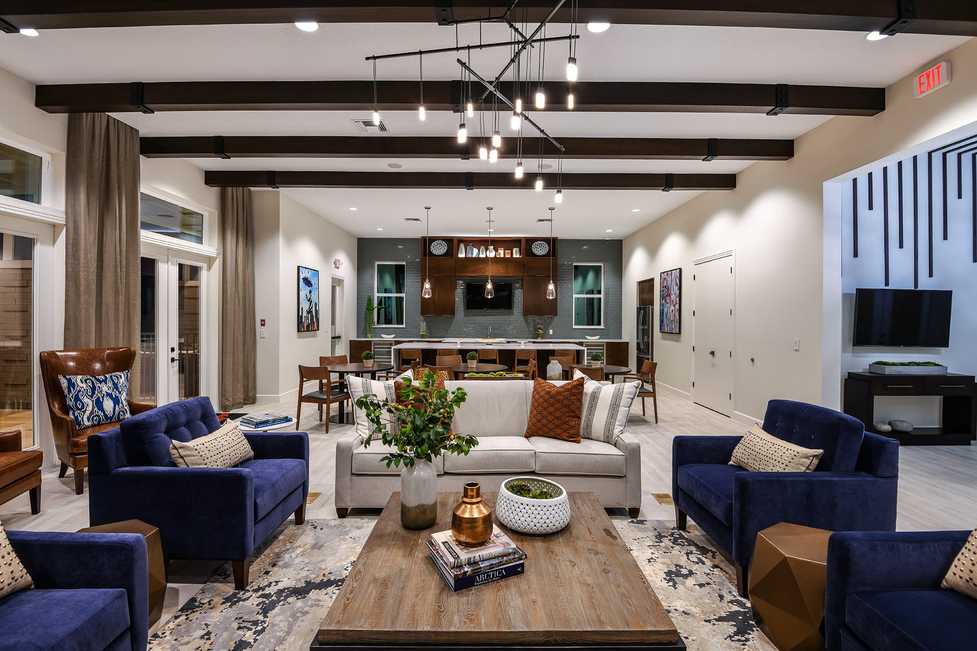 clubhouse with beam accents and kitchen