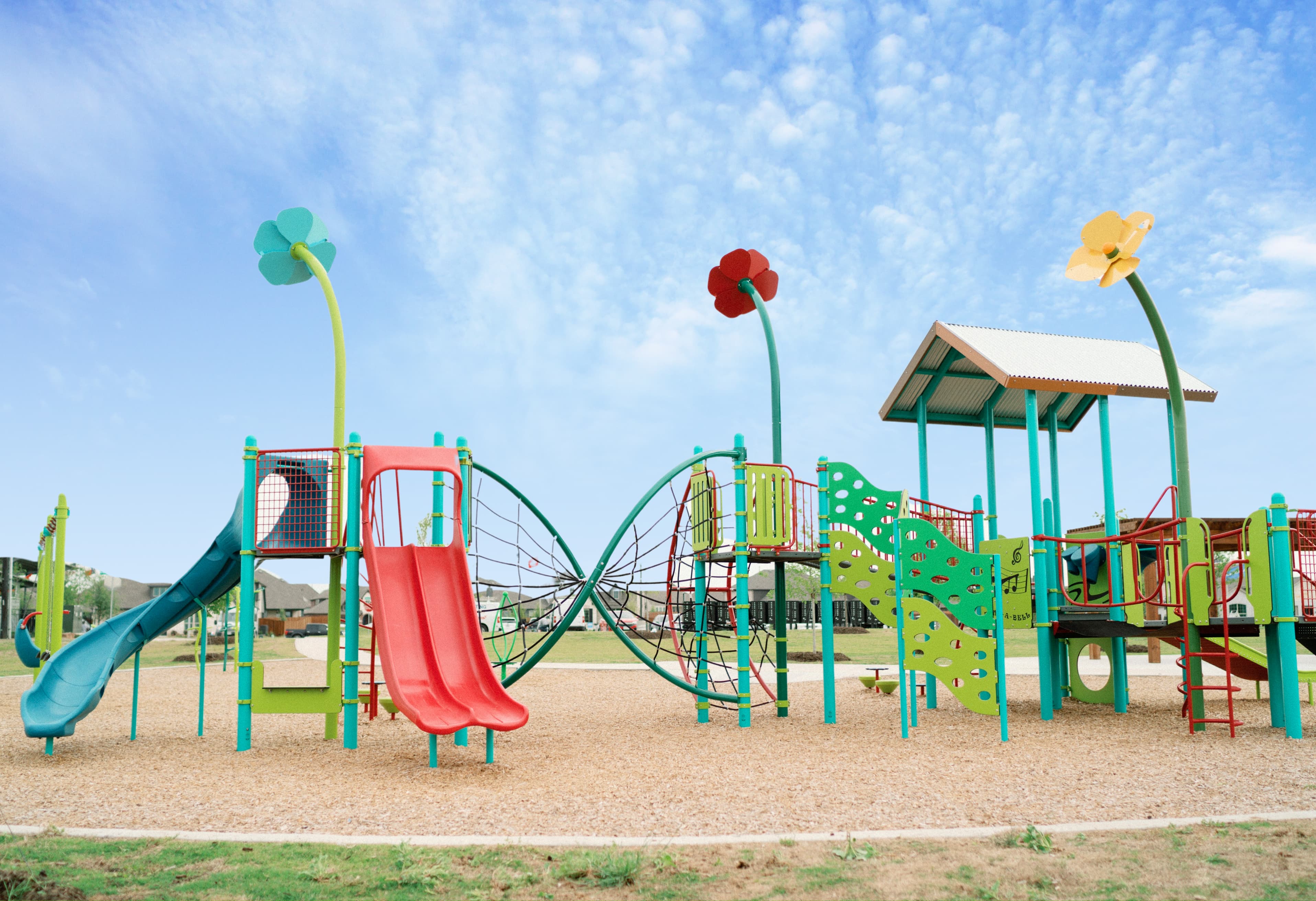 playground with a slide and climbing wall