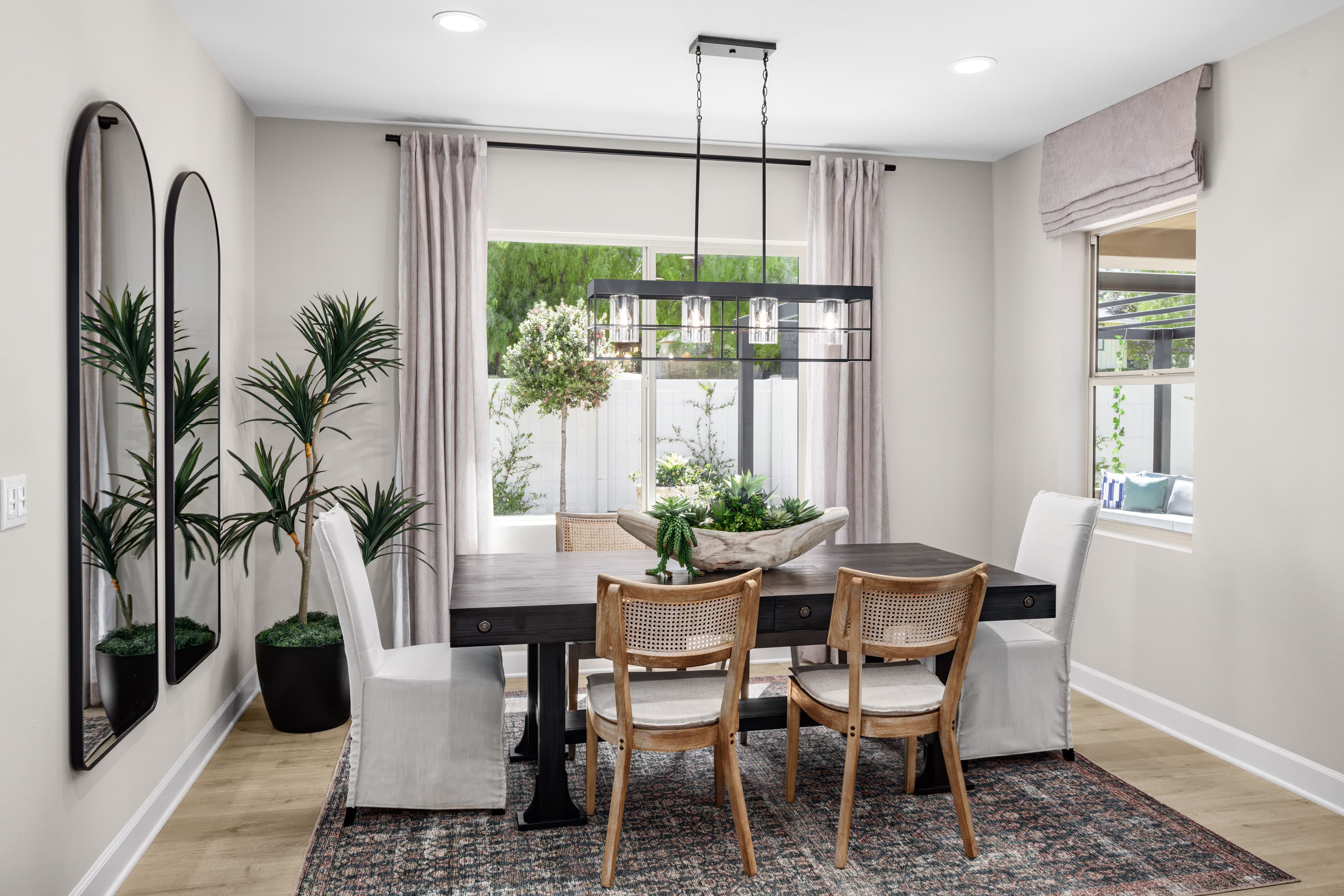 dining room with neutral floors and large window