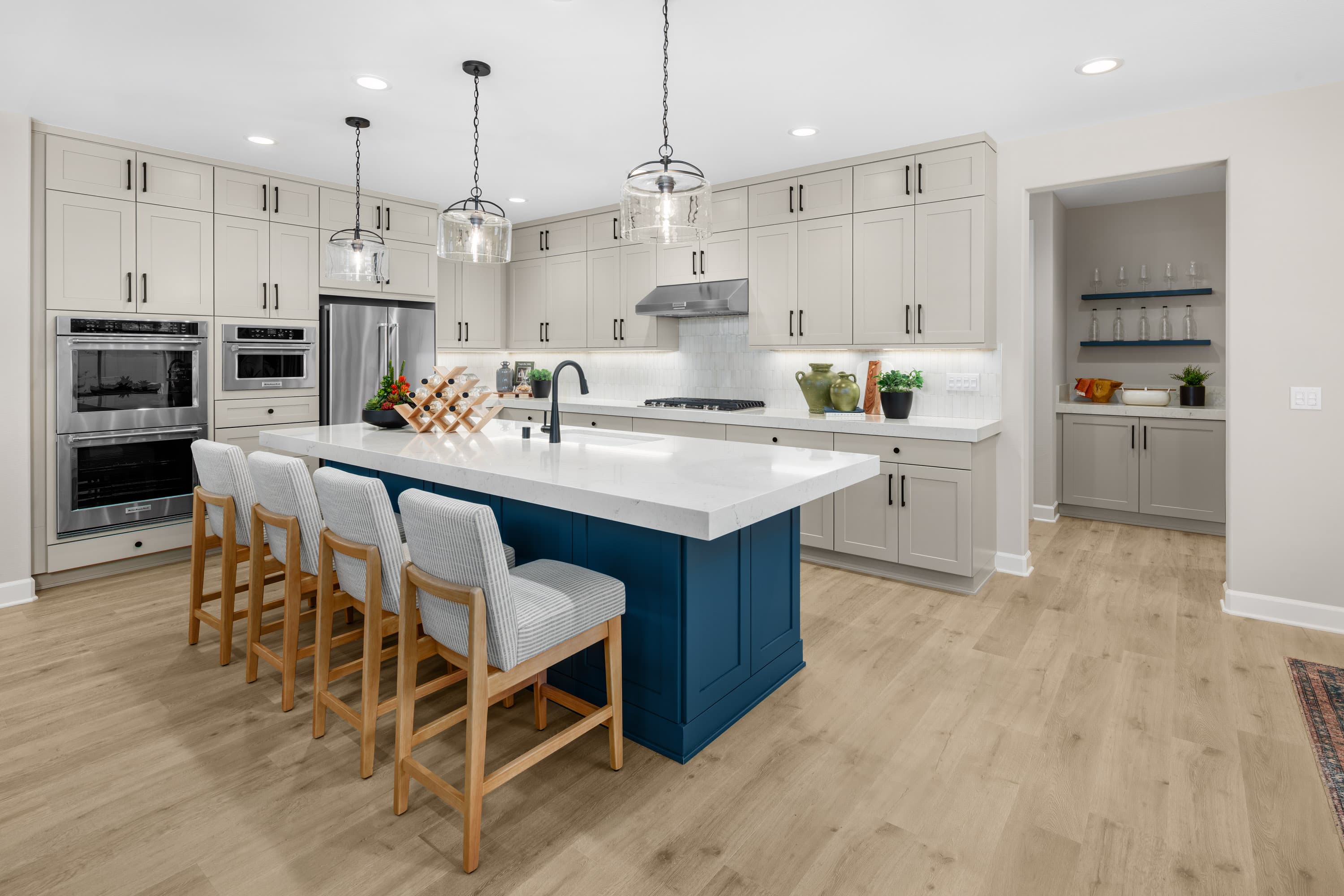kitchen with large island and neutral backsplash