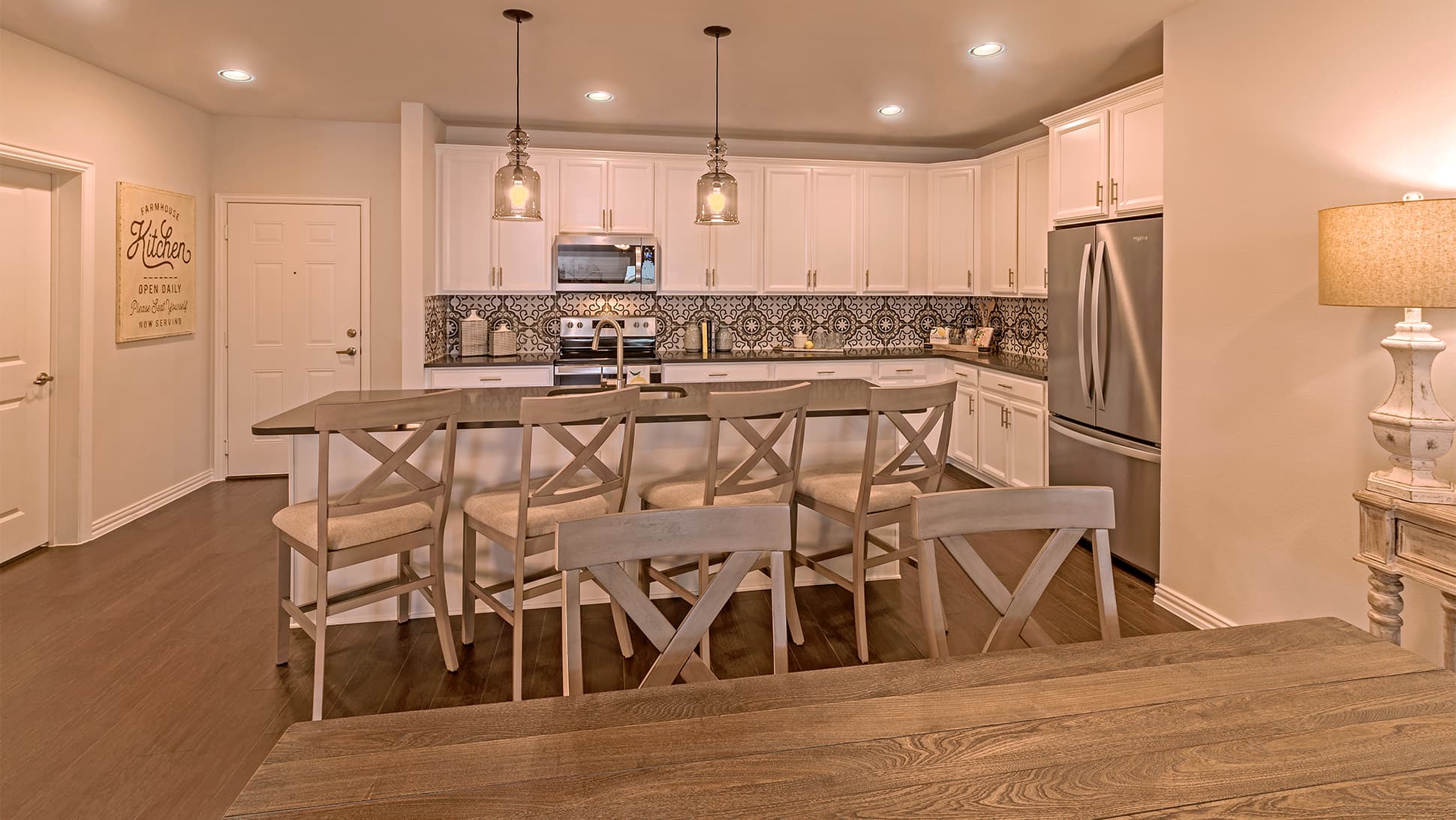 open kitchen with large island and wood floors