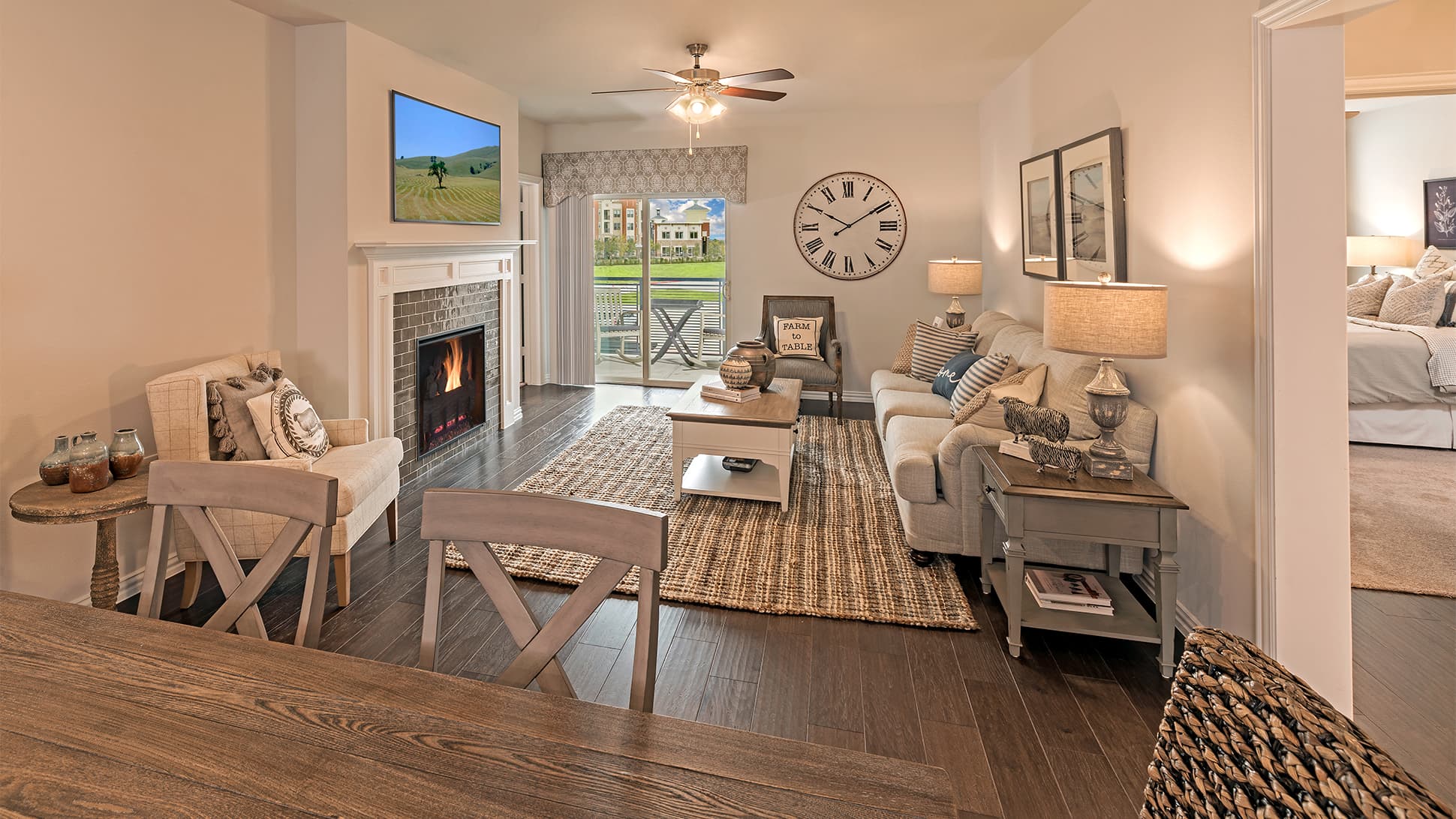 living room with wood flooring and brick fireplace