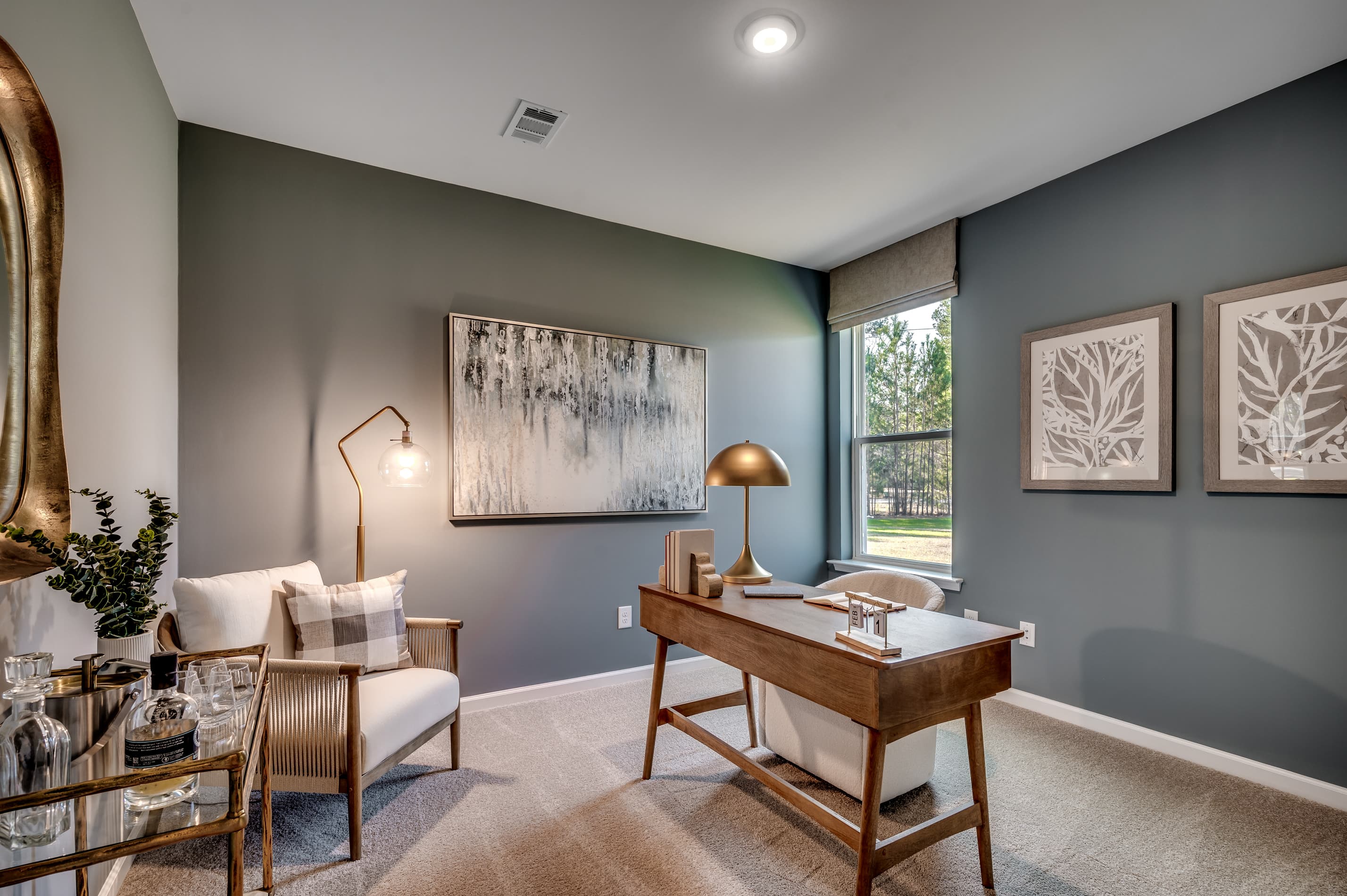 study with blue walls and tan carpeting