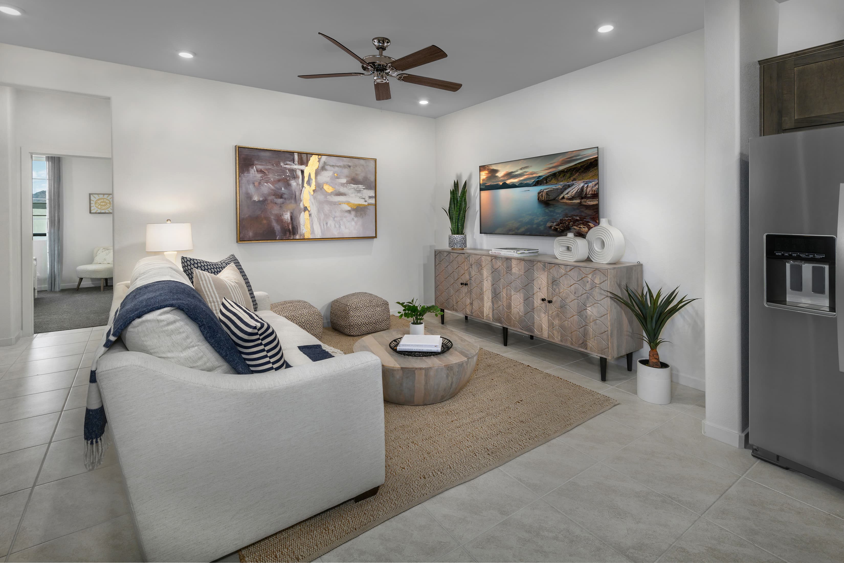 furnished living room with ceiling fan