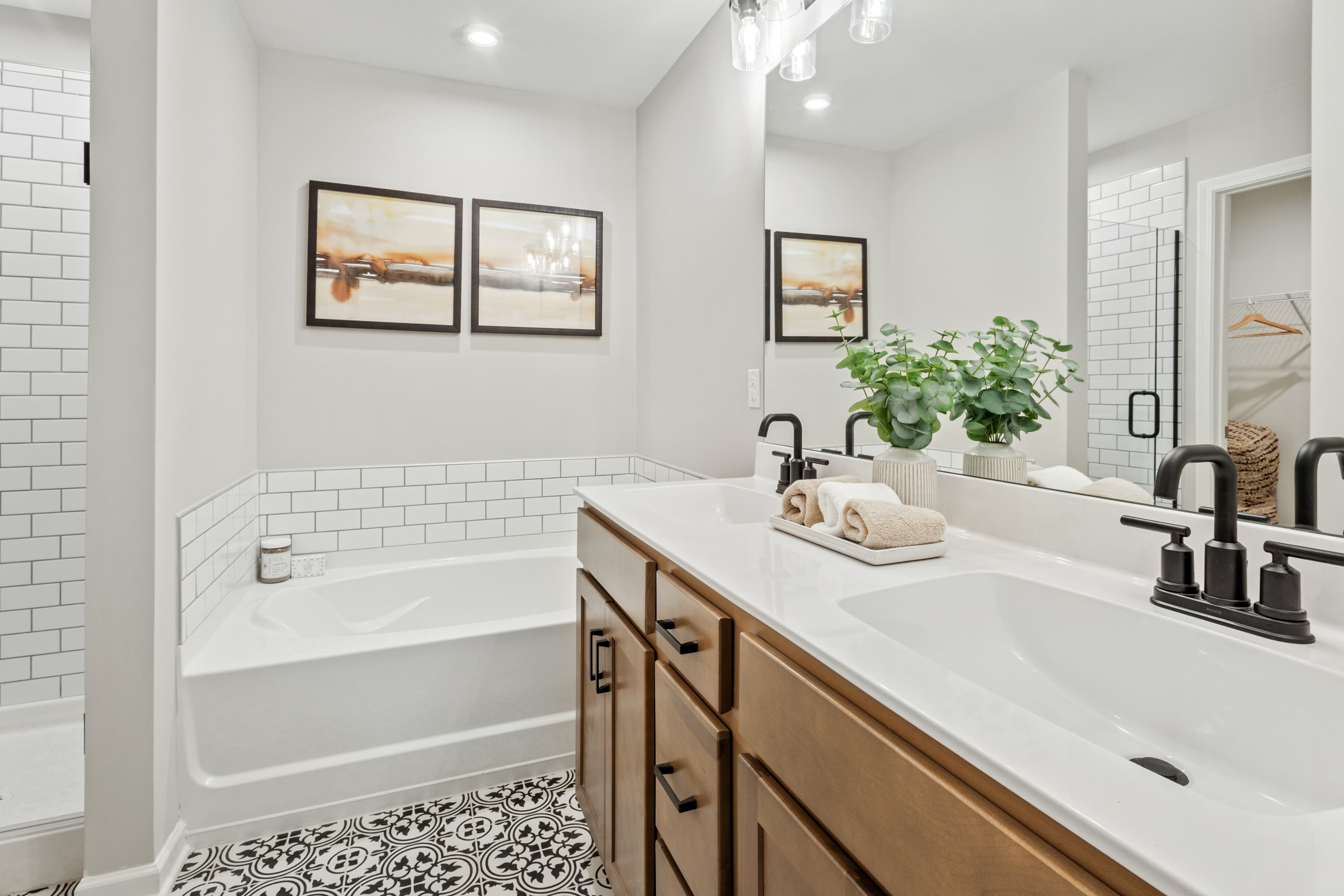 bathroom with wood cabinets and accent tile