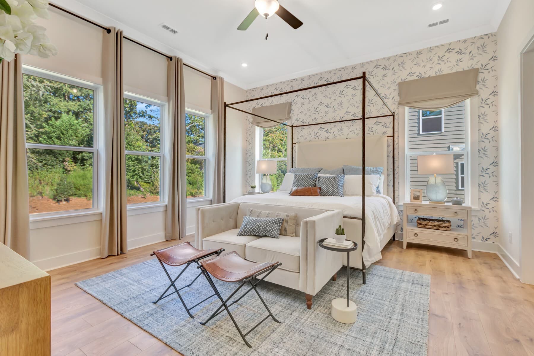 first floor primary bedroom with multiple windows