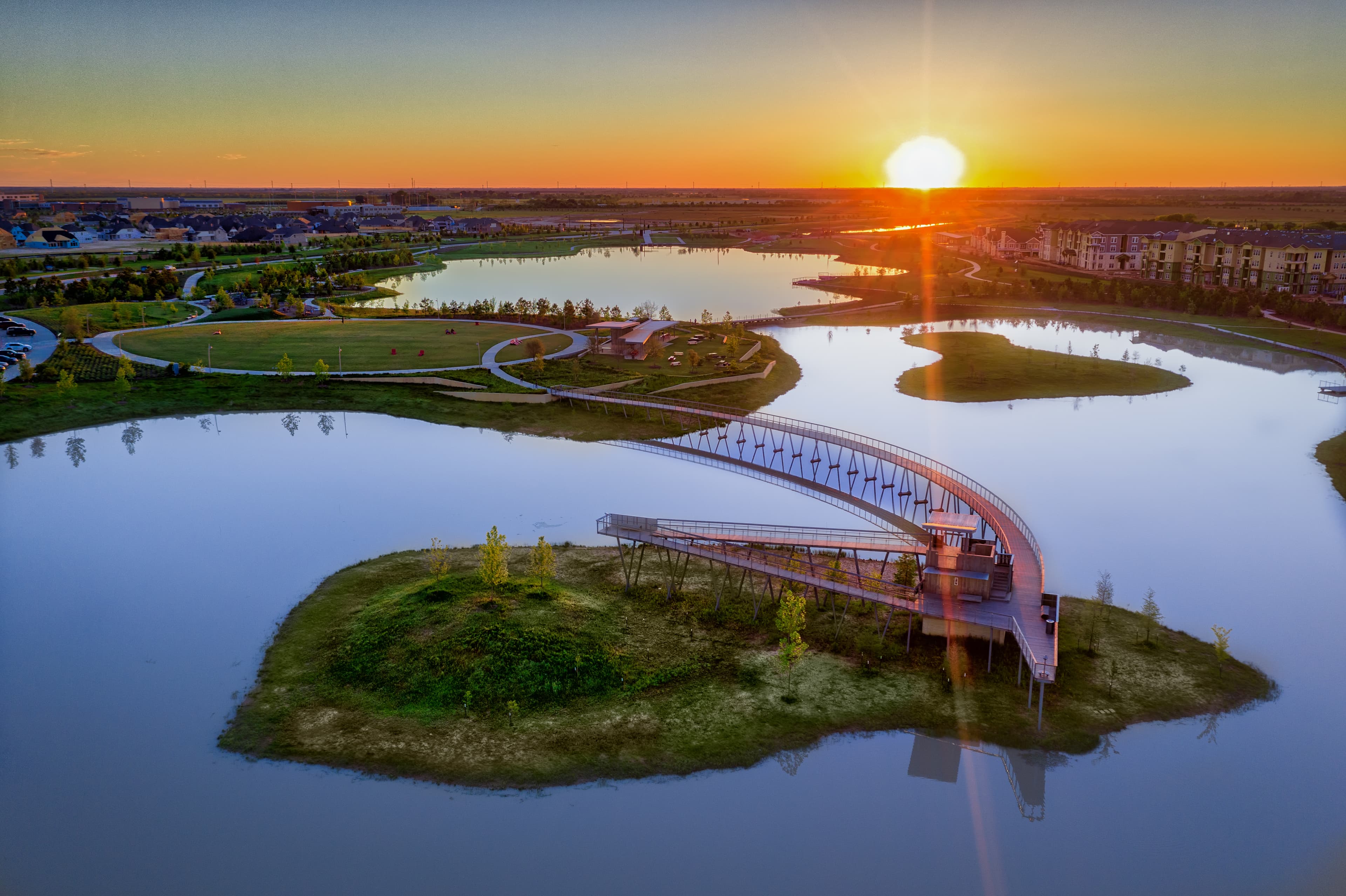 lake with bridge and walking trail