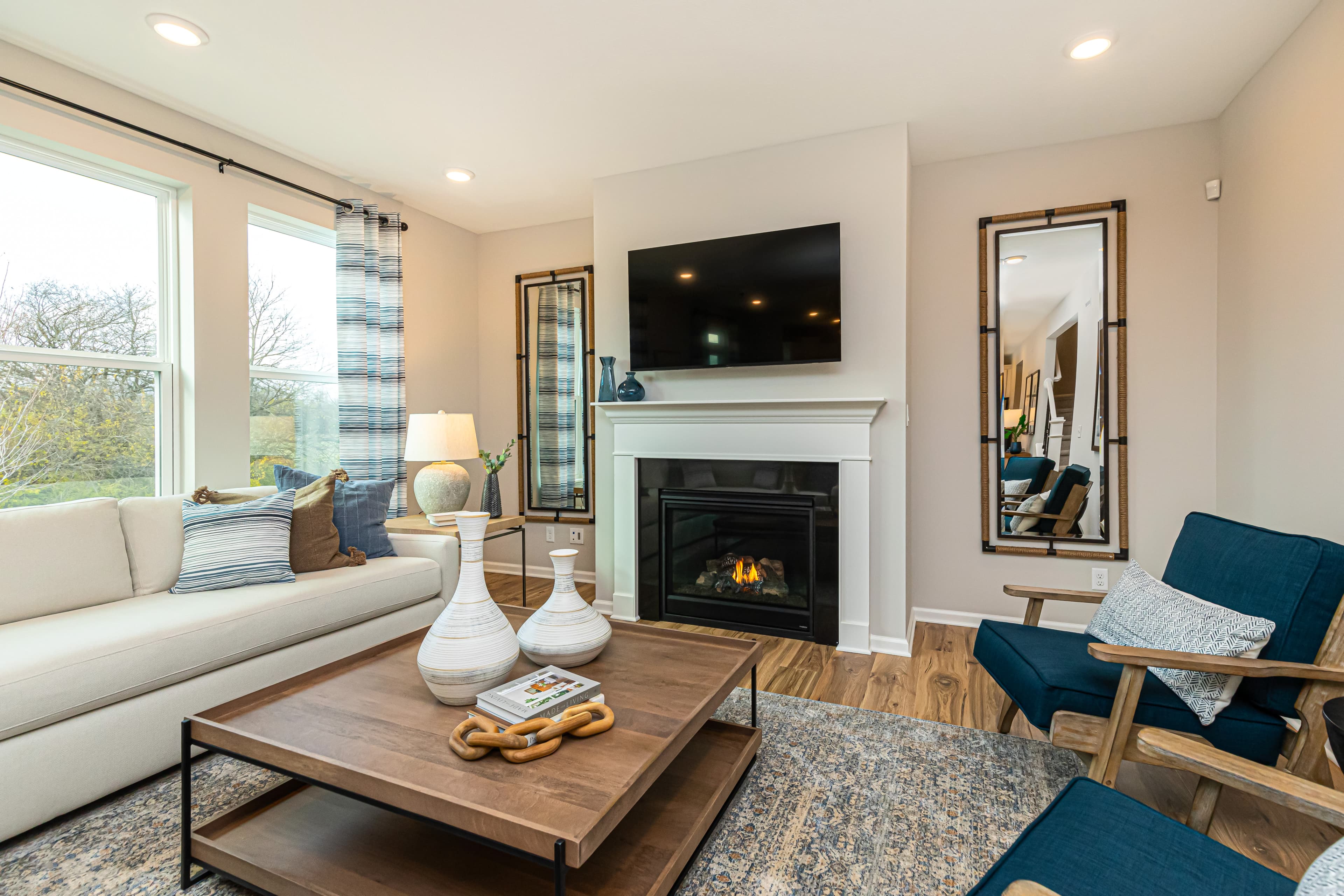 great room with fireplace and hardwood floors 