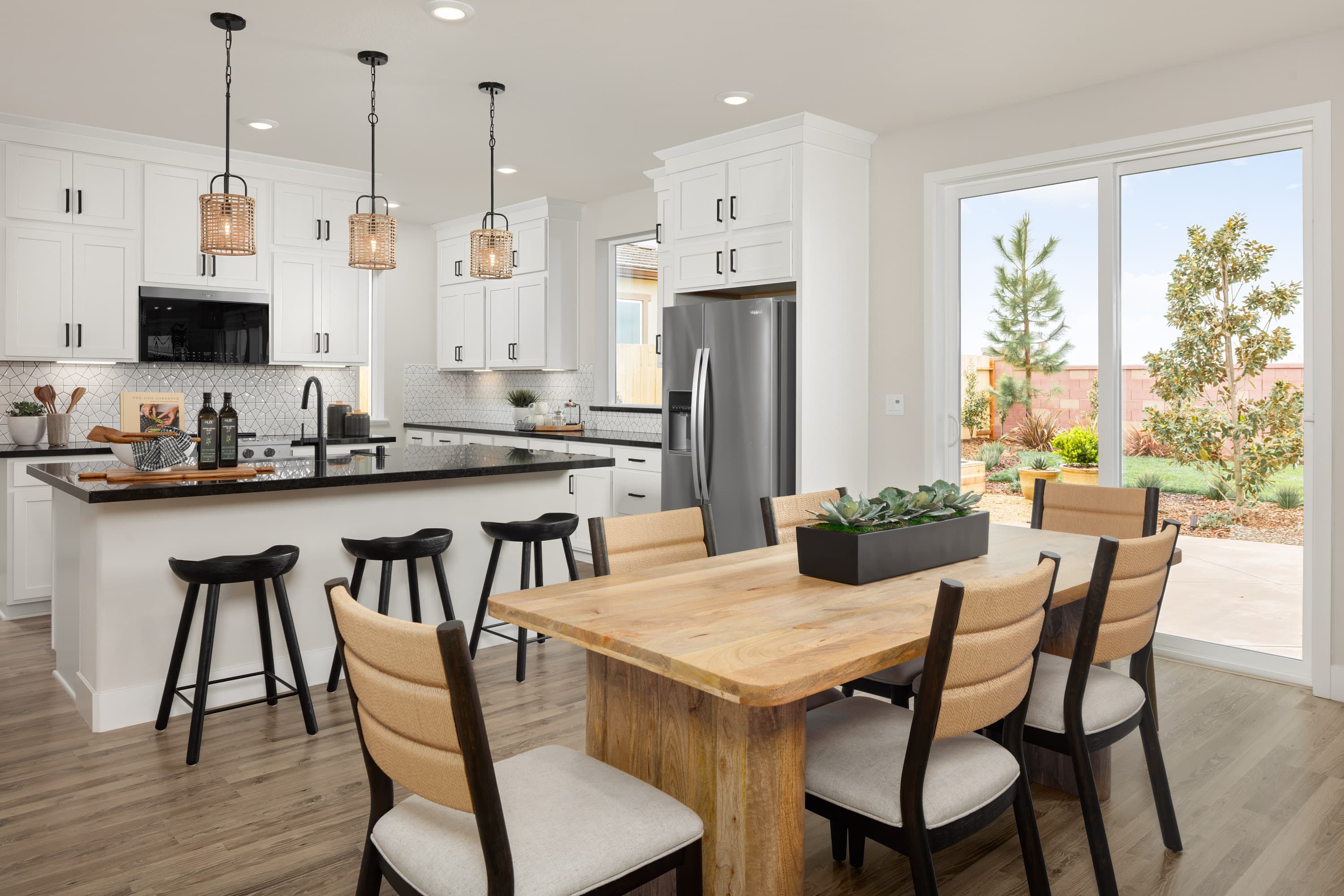 kitchen with white cabinets and black counters