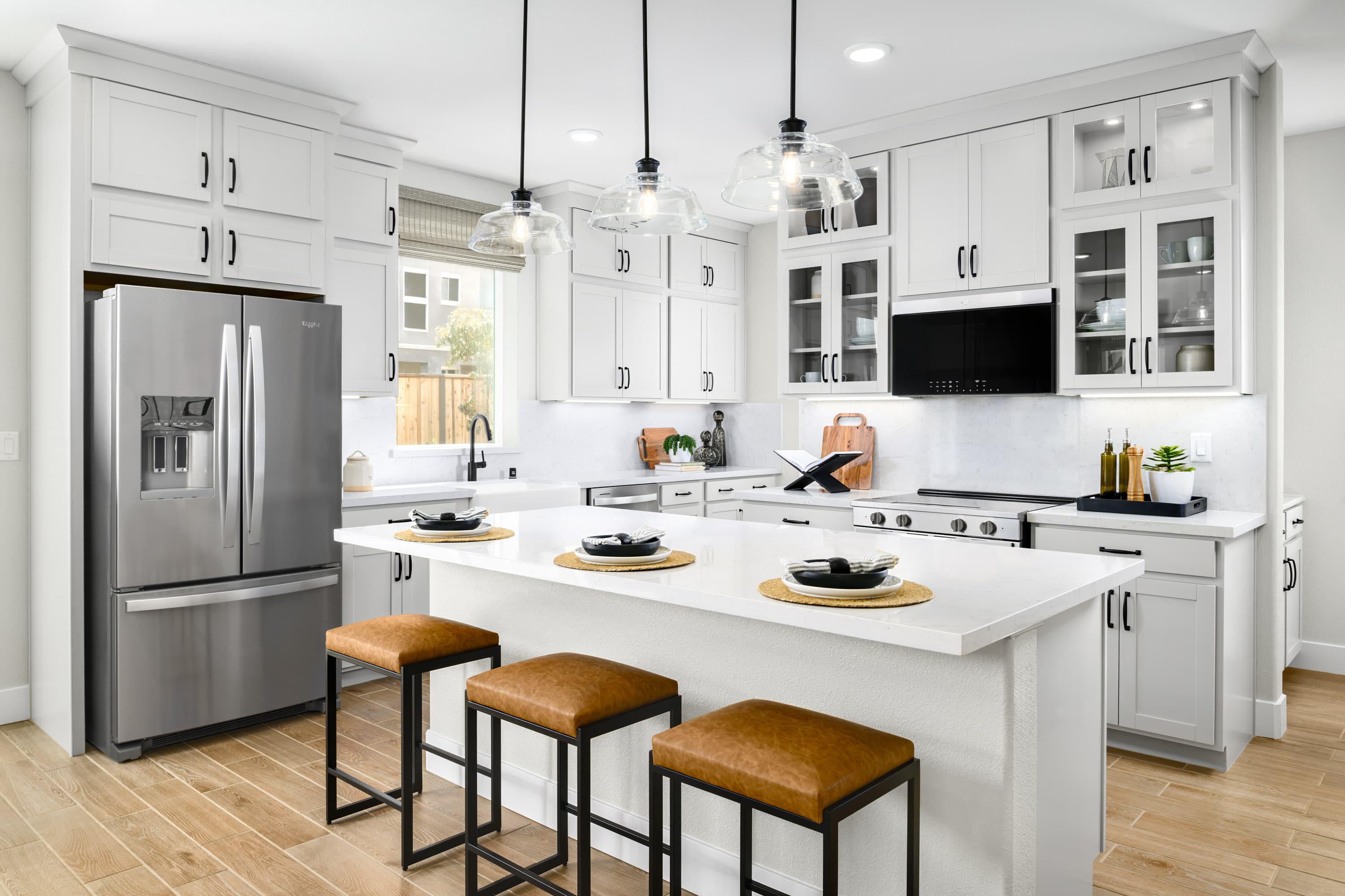 stylish kitchen with large island and bar stools