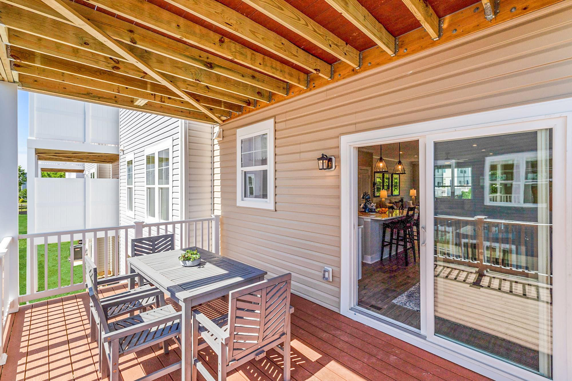 covered deck off the breakfast area and kitchen