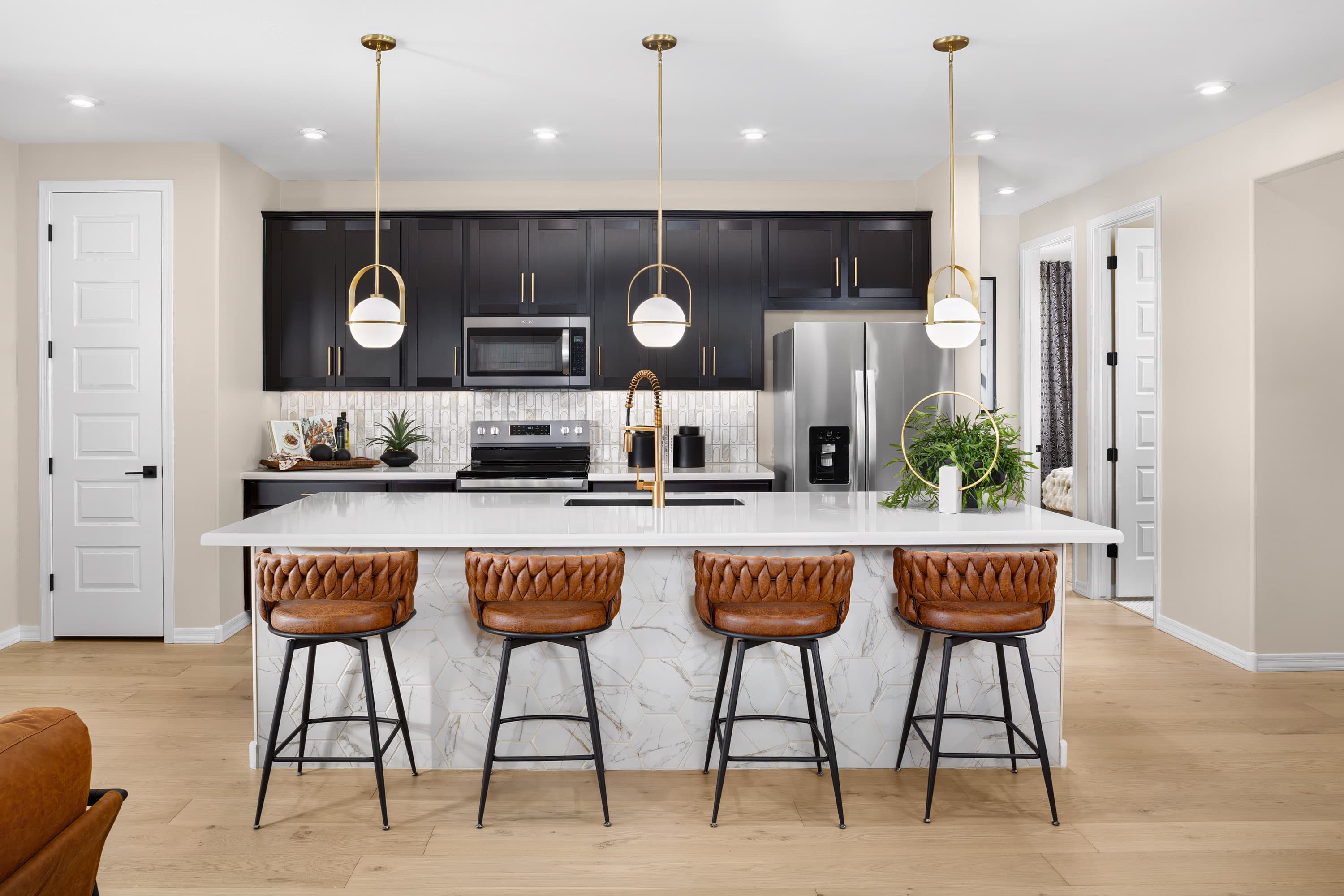 large kitchen island with brown leather barstools