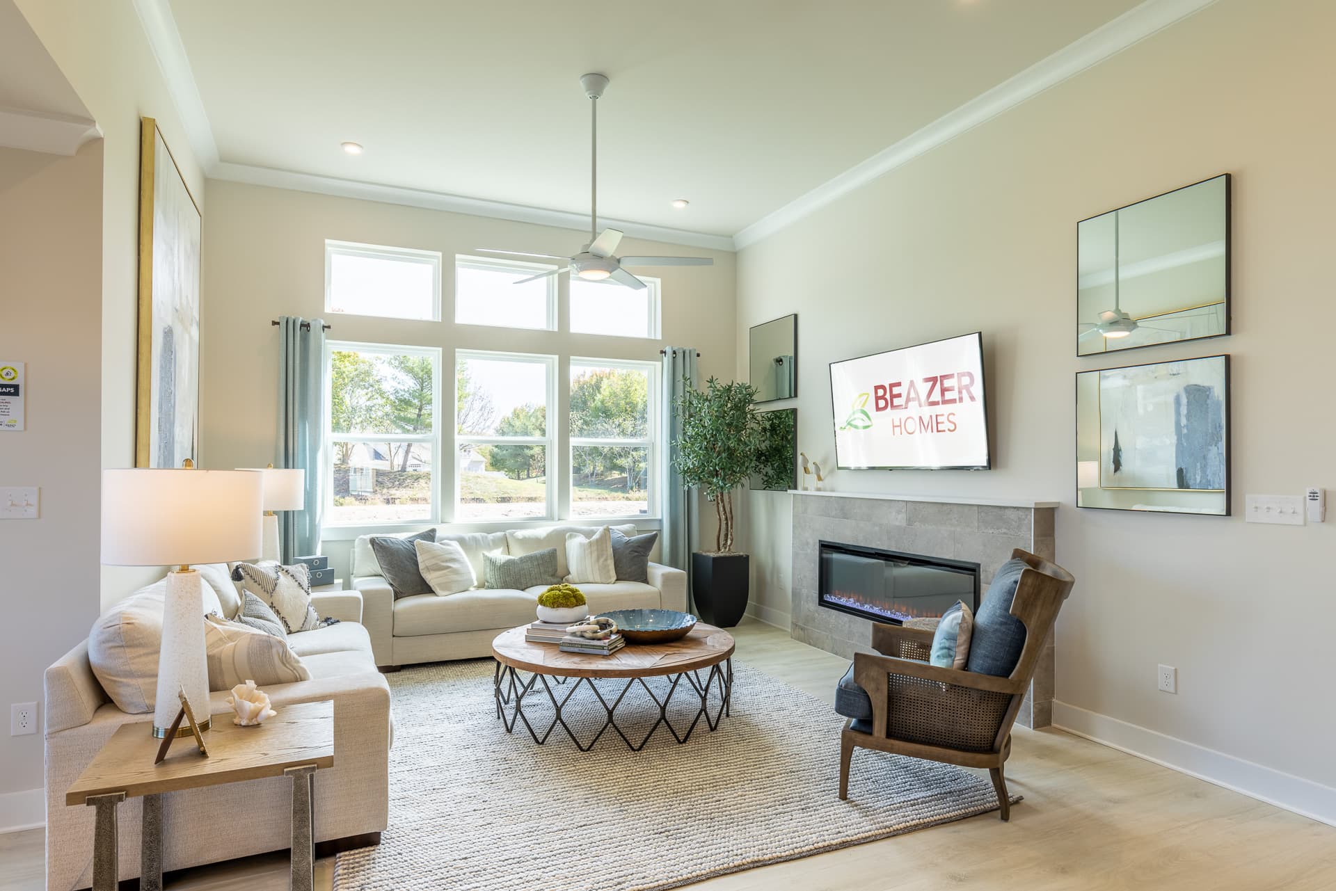 great room with a fireplace and couches
