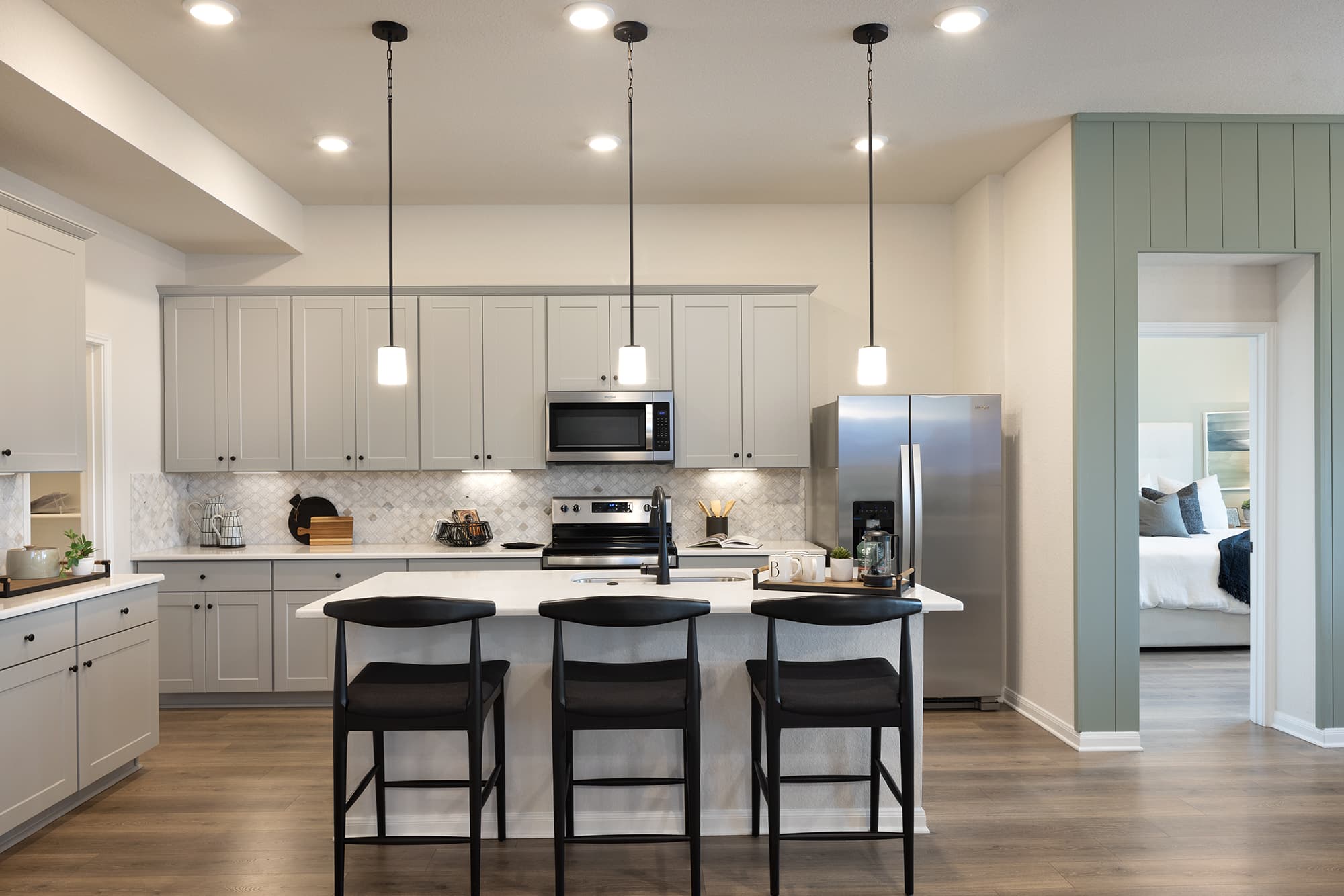 kitchen with white countertops & gray cabinets
