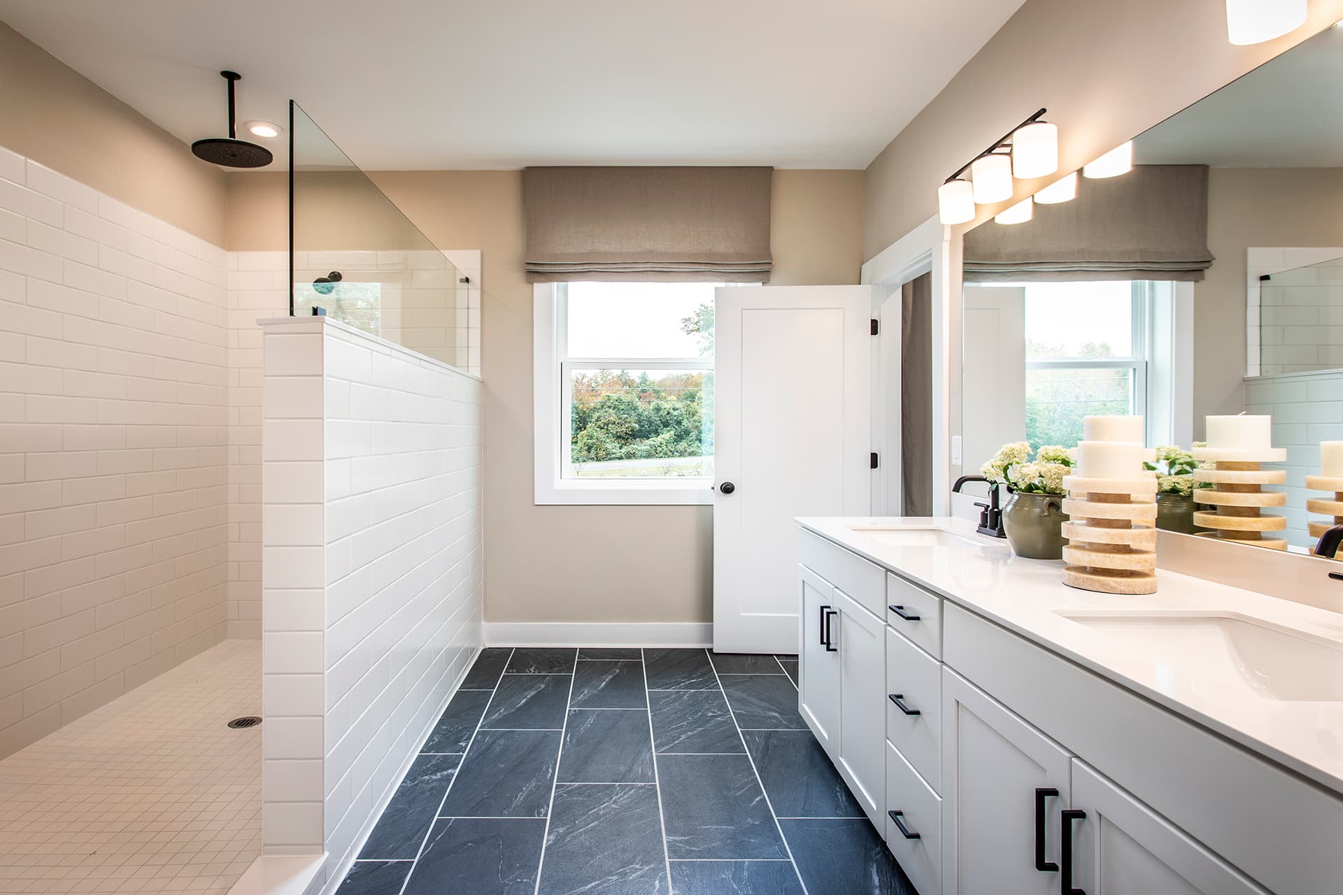 primary bath with walk-in shower & white cabinets
