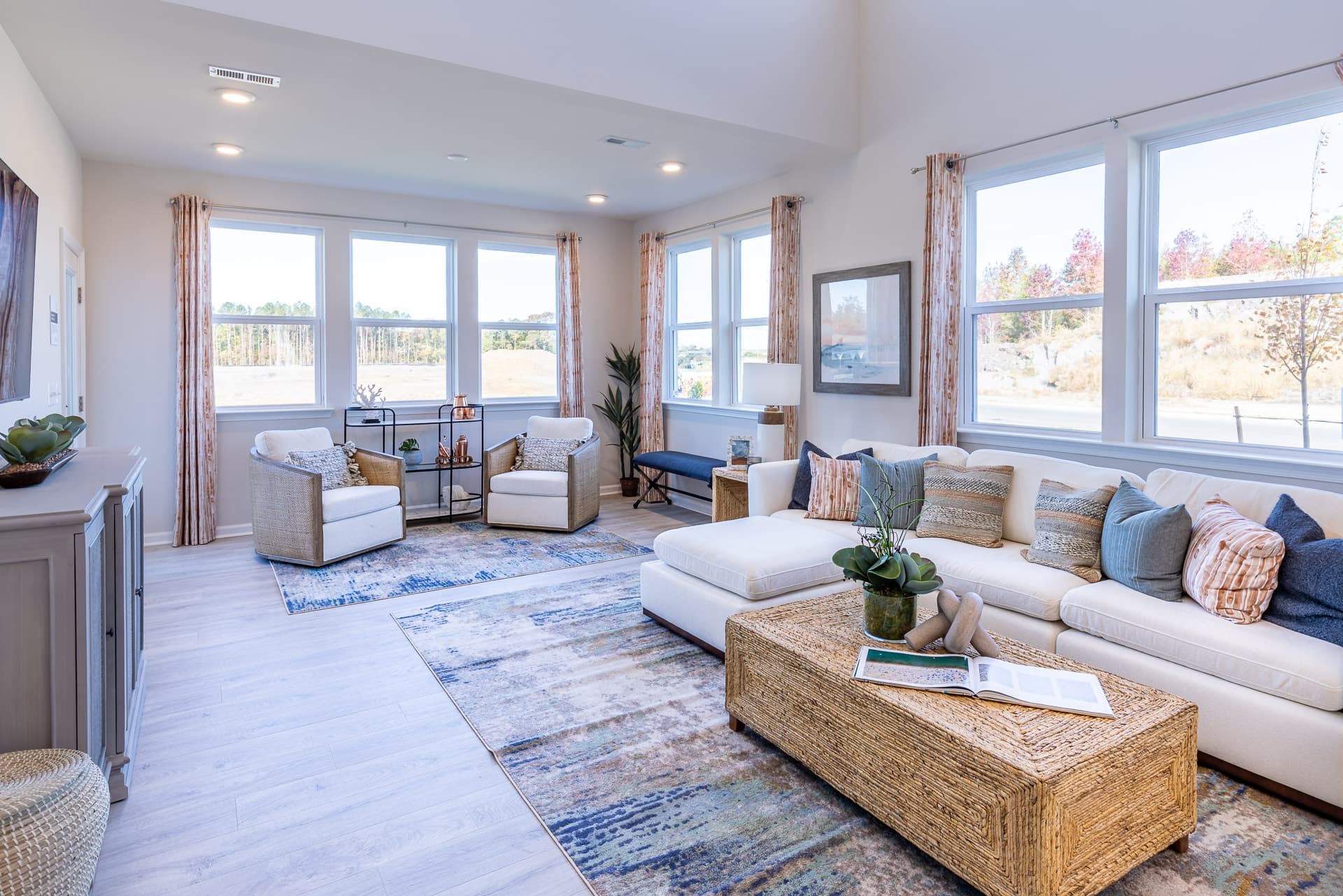 great room with a white couch & designer floors