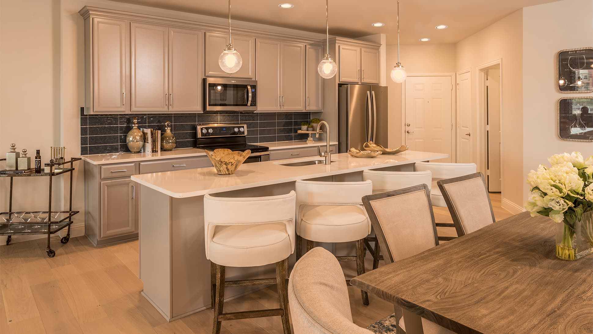 open kitchen with large island and wood floors