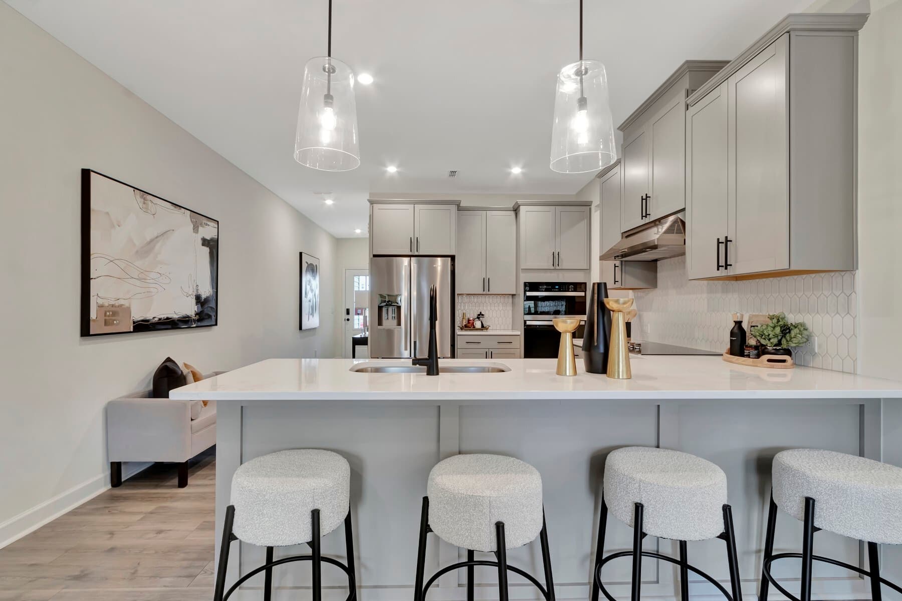 l-shaped kitchen with four bar stools 