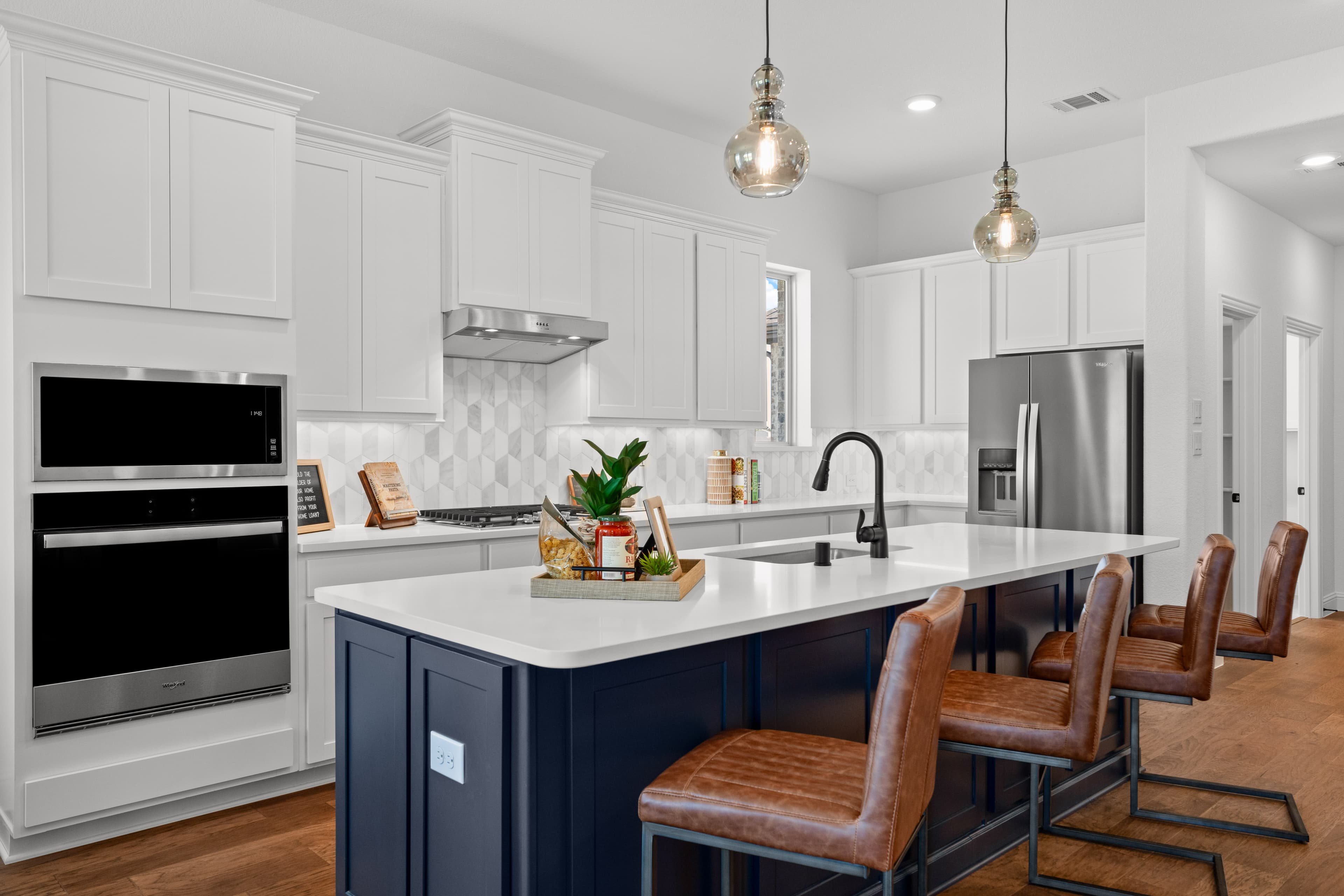 open kitchen with large island and hardwood floors