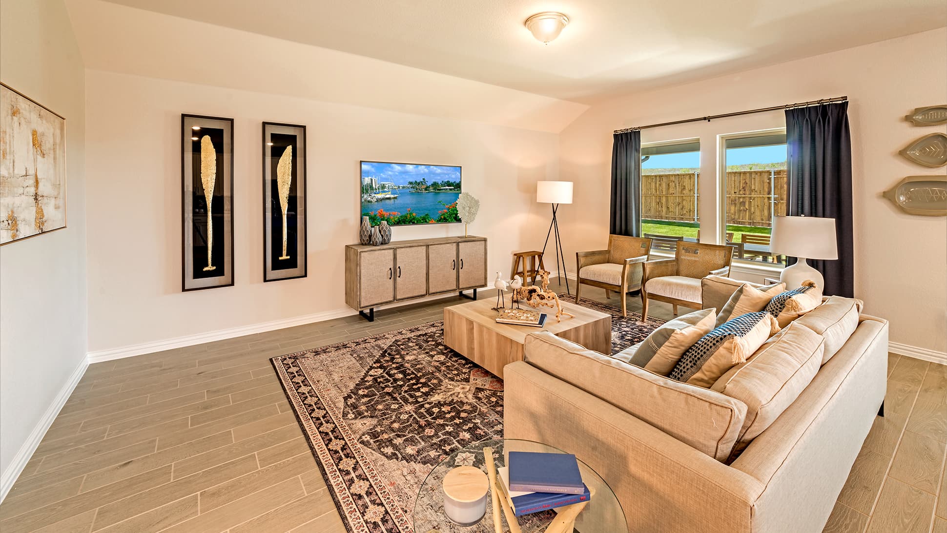 open great room with wood floors and large windows