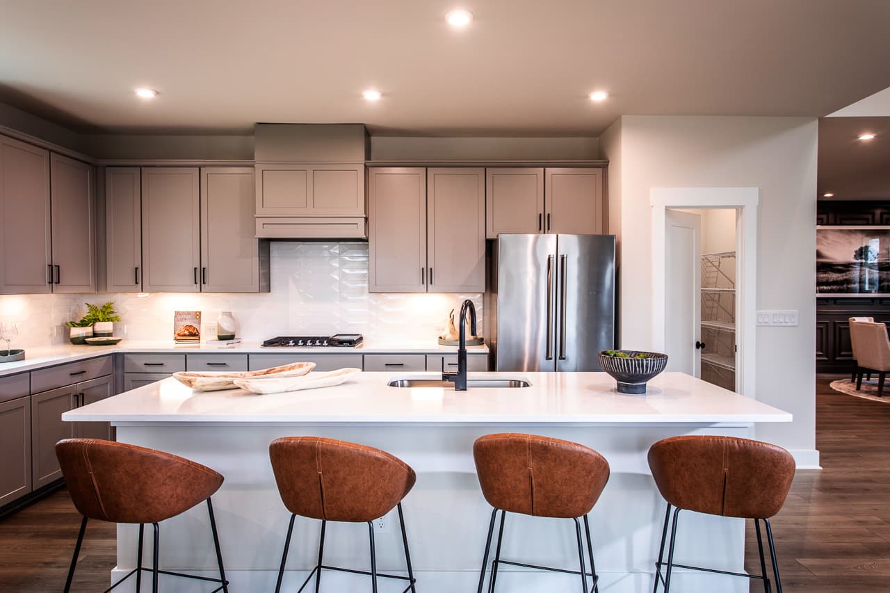 kitchen with expansive island and quartz counters